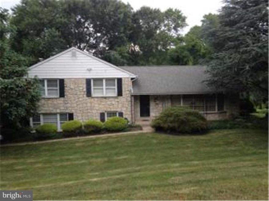 Original owner and Well maintained stone front home with lots to offer. deck over looking wooded lot, eat in kitchen large living room, dining room combo, lower level family room and laundry room. four spacious bedrooms master bedroom with master bath. home is set back in the 70's era needs cosmetic updating but priced 40k less then the comps on the block. Hardwood and parquet under carpet, a great deal for someone willing to bring it into todays world. Large basement with high ceiling ready to be finished. 2 car attached garage with inside entrance, oversized driveway for plenty of parking. Award winning Springfield school district, close to shopping and transportation.