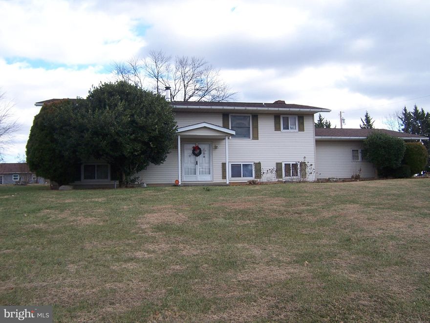 LARGE SPLITFOYER SHOWING 5 BEDROOMS, 3 FULL BATHS FORMAL DINNING + FAMILY DINNING AREA KITCHEN JUST UP GRADED SETS ON CORNER LOT  JUST OVER HALF AC. IN OLDER  WELL CARED FOR  SUB-DIVISION. 2 CAR ATTACHED  GARAGE AND 2 CAR +WORKSHOP GARAGE DETACHED. HOME HAS BEEN KEEP UP , BUT DATED, WITH HUGE AMOUNT OF SQUAREFOOT AGE.LARGE DECK WITH A BUMB OUT AREA OVERLOOK BACK YARD .LARGE LIVING ROOM WITH FAMILY ROOM IN LOWER AREA FIREPLACE AND PELLET STOVE. LAUNDRY ROOM WITH DOUBLE SINK AND PANTRY STORAGE ROOM .RARE SUB-DIVISION TO GET A HOME FOR SALE IN BETWEEN EXIT 16 AND 14 OFF OF I-81 WITH RT 9 AS  A ENTRANCE.