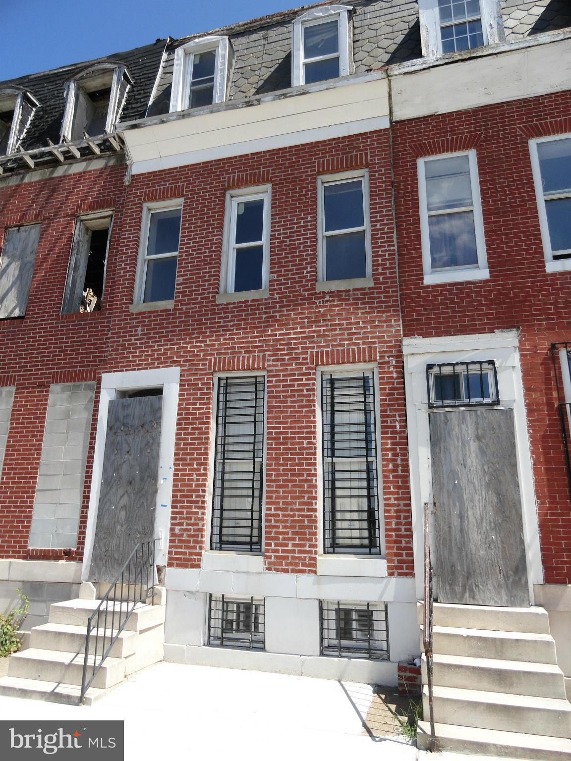 Investor property. Needs complete renovation. Possible mold. 3 levels and unfinished basement. Easy rear access and rear parking.