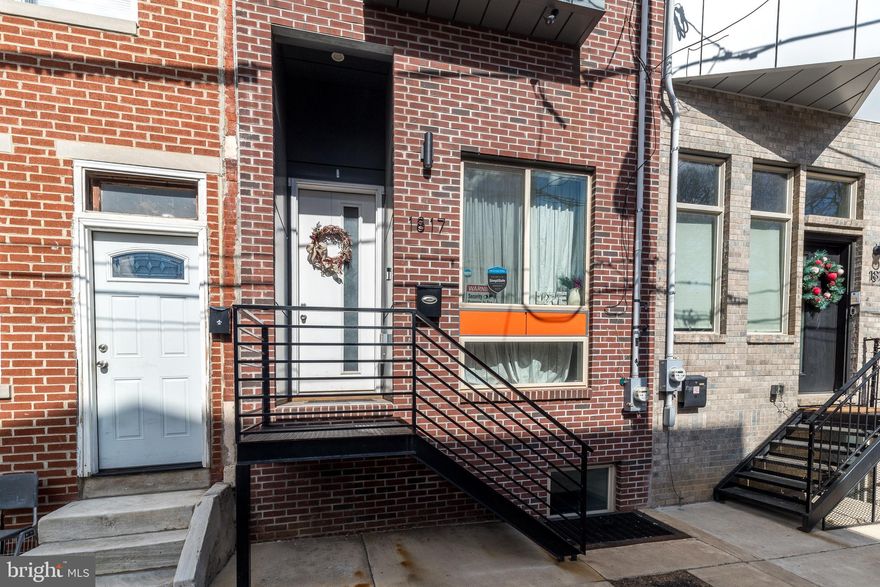 Welcome to this spectacular 4-bedroom, 4-bath townhome nestled in the vibrant Sharswood neighborhood, right next to buzzing Brewerytown and a 10 minute walk to Fairmount!!   Offering sweeping panoramic city views from your private rooftop deck, this contemporary gem is more than just a home — it’s an incredible investment opportunity with SIX YEARS LEFT ON VALUABLE TAX ABATEMENT.

Step inside and fall in love with the gleaming hardwood floors stretching across all three levels, the abundance of natural light pouring through oversized windows, and the sleek recessed lighting that highlights every stunning detail. The main living space features dramatic 14-foot ceilings and a cozy electric fireplace — perfect for relaxing evenings.

Just a few steps up, you'll find a spacious open-concept dining area and a modern island kitchen outfitted with stainless steel appliances, granite countertops, and sliding doors leading to a deck and fenced-in back patio — an entertainer’s dream!

The second floor offers two generously sized bedrooms, including one with a private bath and another full hall bath with a walk-in shower. On the third floor, retreat to your expansive primary suite, complete with a spa-like bathroom boasting double vanities and a deluxe oversized shower. You’ll also find a convenient wet bar, laundry area, and a bonus room that’s perfect for a fourth bedroom, office, den, fitness studio, or luxurious dressing room — endless possibilities await!

Take in the sparkling skyline from your rooftop oasis or host unforgettable gatherings in the fully finished basement with another full bathroom and plenty of storage.

All the luxury of new construction — without the wait! Plus, you'll be minutes from FAIRMOUNT, Temple University, trendy coffee shops, popular restaurants, public transportation, I-76, and Center City.  Street parking is always available!

Quick settlement is possible — schedule your private showing today!