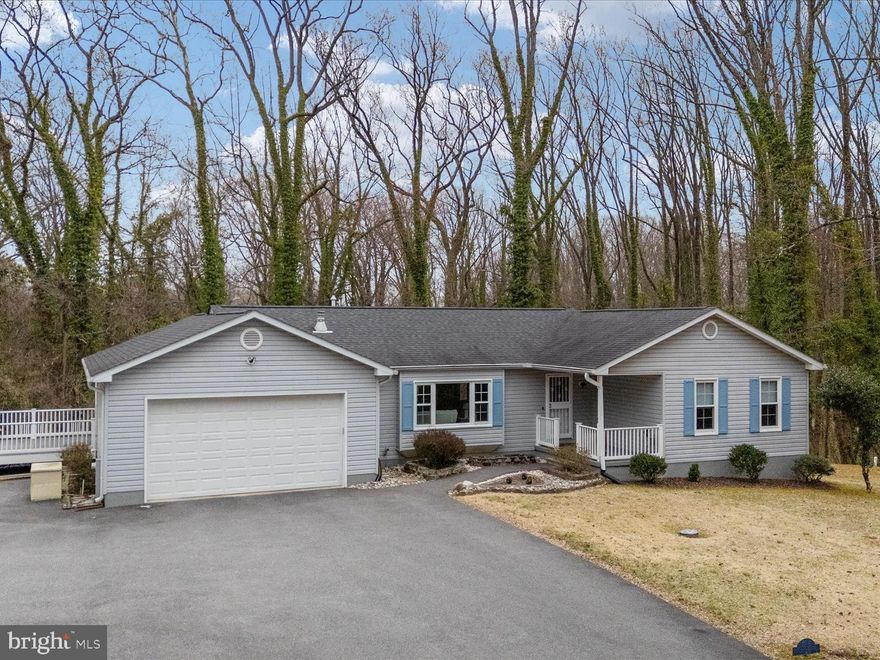 Location, location, location! Enjoy the amazing privacy of this home that is just a hop, skip, and a jump from the United States Naval Academy, Downtown Annapolis, and Anne Arundel Community College—yet set far back off the main road with two acres of privacy to enjoy!  Pride of ownership shows thoroughout this entire home!

Discover the perfect blend of comfort and functionality in this charming ranch-style home, nestled on a sprawling 2-acre lot. Built in 1996, this beautifully maintained residence offers 2,728 square feet of inviting living space, ideal for creating lasting memories. The home has been freshly painted and features LVP flooring throughout most of the space, adding a modern touch and durability to everyday living.

Step inside to find a warm and welcoming atmosphere, highlighted by a cozy gas fireplace that serves as the heart of the home. With four spacious bedrooms and three full bathrooms, there's ample room for relaxation and privacy. The main floor laundry adds convenience to your daily routine, making chores a breeze.

The finished basement, complete with a walkout entrance, provides endless possibilities—whether it's a game room, home office, or guest suite, the choice is yours! Enjoy the beauty of nature from your backyard, perfect for outdoor gatherings or quiet evenings under the stars.

Parking is a dream with a two-car attached garage and a generous driveway that accommodates plenty of parking. The combination of thoughtful design, recent updates, and meticulous maintenance ensures that this home meets all your needs.

Located in a peaceful, private setting, yet close to so many local amenities, this property offers the best of both worlds. Embrace the lifestyle you've always wanted in a home that truly feels like a retreat. Don't miss your chance to make this delightful residence your own!