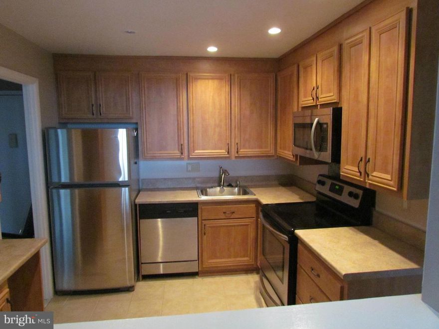 Great location, fabulous view of downtown Towson...walking distance to mall and restaurants. This 2 Bed, 2 Full Bath upper level condo that has just been updated, new bathrooms, tile in kitchen, SS Appliances, freshly painted and upgraded carpet cleaned and in unit W/D.  There are many amenities here, security doors, intercom system, pool, tennis, and much more.