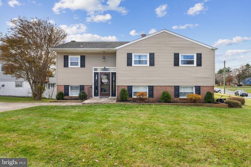 Located on a desirable corner lot in Perry Hall Village, this updated four-bedroom, two-bath home stands out for its design, amenities, and walkability.

The main level offers an open-concept layout that connects the kitchen, dining, and living areas seamlessly. Recent updates include luxury vinyl plank flooring throughout most of the home, along with hardwood in two bedrooms and new carpet in a third. The living room centers around a sleek, built-in electric fireplace that adds warmth and modern appeal.

The kitchen is a true showpiece, featuring a Café double oven gas range, custom designer vent hood, quartz countertops, farmhouse sink, and counter-depth Café refrigerator. A sliding door from the dining area opens to the upper deck, perfect for relaxing or overlooking the pool below.

The lower level offers a versatile space for entertaining or unwinding. It includes a second living area with a brick fireplace, wood-burning stove, and built-in bar. The fully renovated bathroom features tile flooring, a soaking tub, and a modern vanity. The fourth bedroom can easily serve as an office or fitness space. A laundry room, utility room with storage, and an additional refrigerator add convenience.

Outside, the backyard feels like a private retreat. The built-in pool is surrounded by a privacy fence and complemented by both upper and lower decks, with built-in seating that makes entertaining easy. The property also includes a two-car concrete driveway and attic storage.

This home’s location offers exceptional walkability to Snyder Park, Honeygo Elementary, local shops, and restaurants. With its modern updates, thoughtful layout, and private outdoor oasis, this Perry Hall home is move-in ready and built for year-round enjoyment.