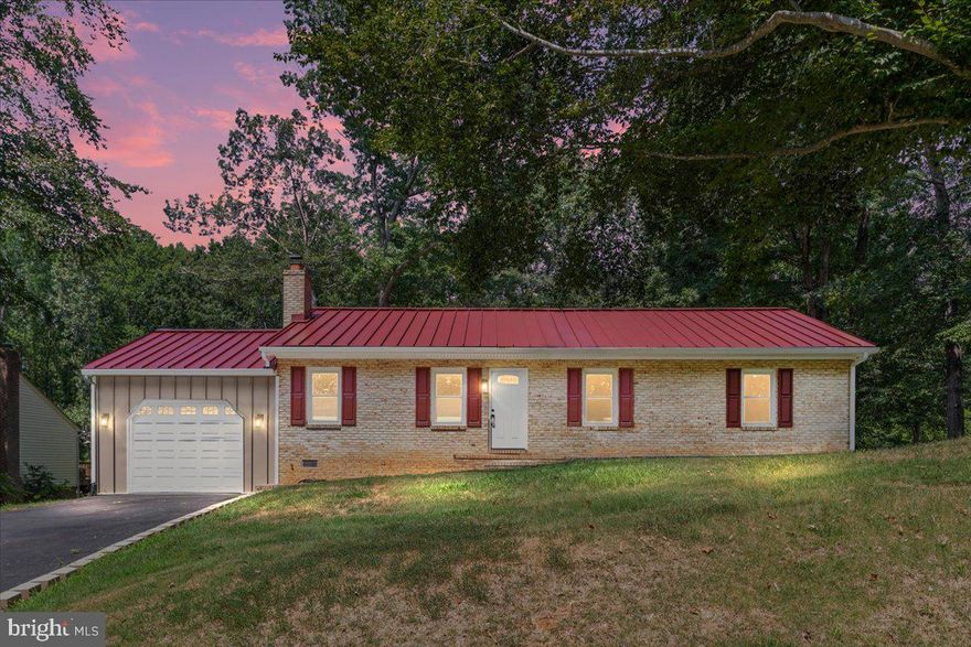 This all-brick ranch has been completely transformed! It is like buying new construction, but without the wait! New 14x15 deck (2025). New metal roof, new heat pump, newly remodeled kitchen with quartz countertops, new microwave and dishwasher (2024). New fixtures and updated bathrooms (2024). Refinished hardwood floors and fresh paint throughout (2024). Newer oven and fridge (2023), washer and dryer (2021/2022), and hot water heater (2017). The attic has been cleaned and reinsulated, and the crawlspace has been encapsulated. The spacious backyard backs to trees—perfect for pets, kids, or just relaxing and entertaining. The one-car garage features vaulted ceilings and loft storage. (Look for the property video and iGuide 3D tour for a virtual experience!). Beyond the property itself, the Lake Arrowhead community offers private lake access for fishing, kayaking and paddleboarding, plus a sandy beach and picnic pavilions for weekend gatherings.- with no HOA dues, you enjoy the amenities without the extra costs. Conveniently located just 7 minutes to Stafford Hospital, 5 minutes to Stafford Marketplace, and 9 miles to Downtown Stafford and the Central Park retail hub. It is rare to find a home with this much to offer—Skip the hassle of expensive renovations and enjoy an updated home from day one.  Come see 65 Boundary Drive for yourself; it’s waiting to welcome you home.