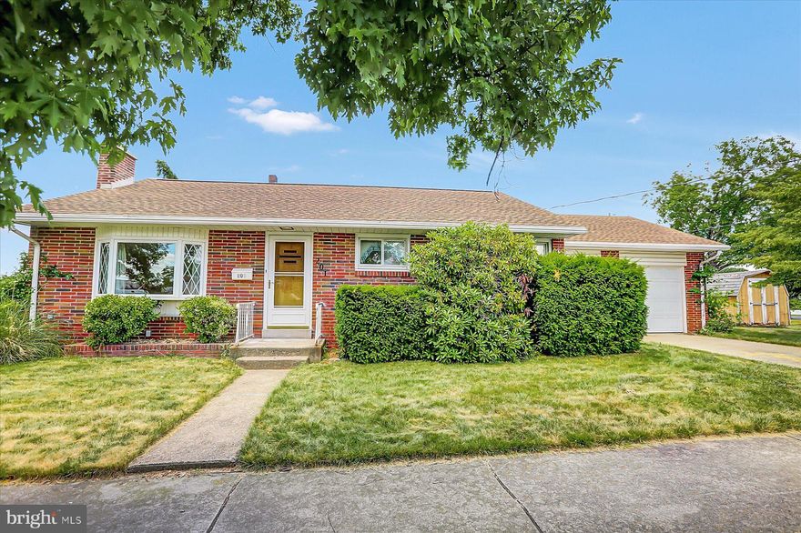 Brick ranch on corner lot features 2 bedrooms, large main bathroom with stackable washer & dryer, eat-in kitchen with all appliances included, original hardwood floors, vintage details, unfinished basement with a half bath and a 1-car garage with a 2nd bay for storage!