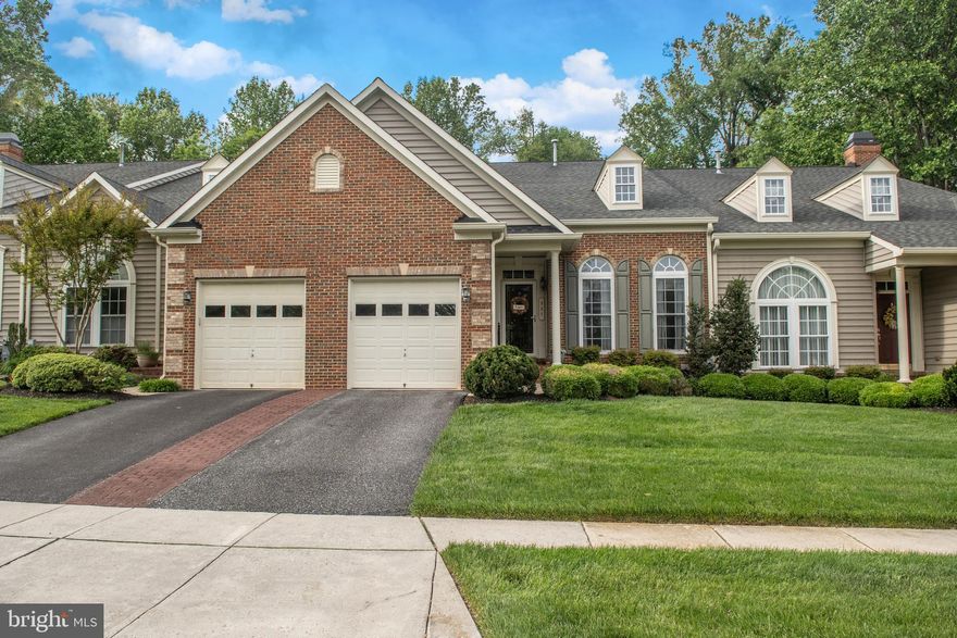 Come see for yourself why these NV built villas in the Meadows @ Bulle Rock are seldom for sale! These award-winning Severn villas (won the 2003 Design of the Year Award in Maryland) offer the best living with luxurious first floor owner's suites, nine foot ceilings, tray ceilings in the gourmet kitchen and owner's suite. And, in addition to the low monthly HOA fee, there is plenty of overflow parking!  Lawn care, mulching, snow removal and trash removal is included! This beautiful brick front home backs to woods and features a Trex deck, stamped concrete patio with fire pit, covered front porch and a one car garage. The main floor features a dramatic 2 story LR with skylight, a formal DR with hardwood floors; a gourmet kitchen with granite counters, stainless appliances & breakfast area; master suite with walk in closet, laundry and half bath. The second floor contains two bedrooms, a full bath and two lofts overlooking the LR. The fully finished basement features as a huge club room with wet bar, full bath, cedar closet and ample storage in the unfinished area. Recent updates include HVAC (2016), Hot Water heater (2017), Granite Countertops (2018), Kitchen Floor (2017), 30  Cooktop (2018), Slider to deck (2015).The Meadows at Bulle Rock is a unique community of 56 homes sited on over 50 acres. It is located just off I-95, near historic Havre de Grace, the Chesapeake Bay and the world-class Bulle Rock Golf Course. Plus, optional memberships are available to an incredible two story 37,000 square foot Residents' Club with fitness center, indoor/outdoor pools, tennis courts and more!