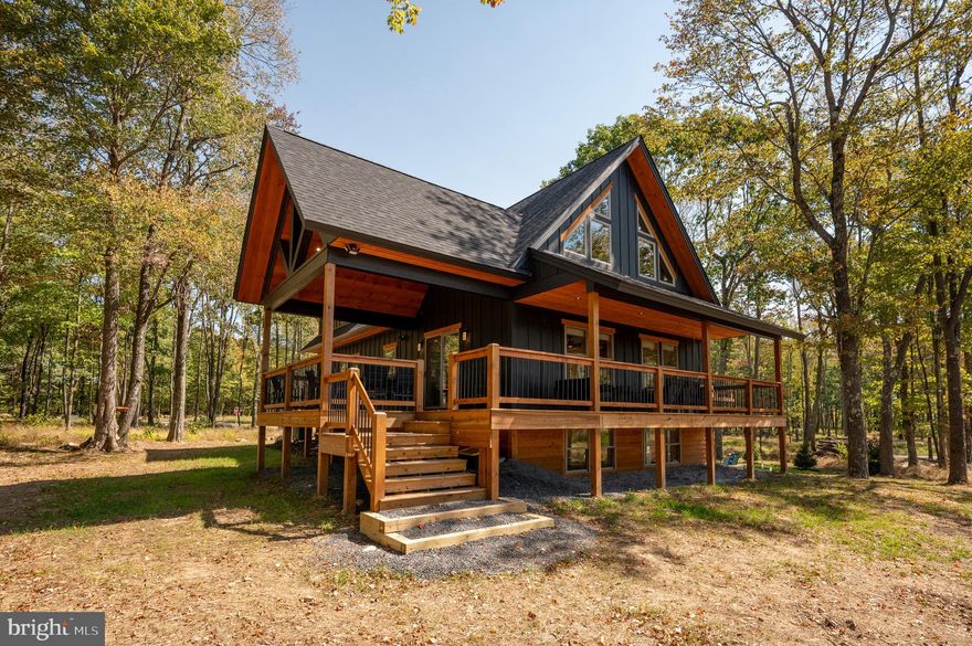 Welcome to All The Time, a beautifully crafted mountain retreat in the heart of Deep Creek Lake and right along Lodestone Golf Course. Blending modern comfort with rustic charm, this inviting getaway is designed for unforgettable moments with family and friends. Inside, the bright open-concept living area features a cozy fireplace and plenty of space to gather after a day of adventure. The fully equipped kitchen and spacious dining area make entertaining effortless, while the expansive deck invites you to dine outdoors, sip morning coffee, or unwind in the fresh mountain air. End your evenings around the fire pit or relax in the hot tub under the stars. Just minutes from the lake, golf courses, hiking trails, and local favorites, Fishing/swimming access off of Marsh Hill Rd on Deep Creek Lake! All The Time offers the perfect mix of comfort, location, and mountain-lake magic. With its strong appeal as both a personal retreat and income-producing vacation rental, this home is ready to be enjoyed from day one. Whether you're seeking adventure, relaxation, or both, this Deep Creek escape delivers it all.