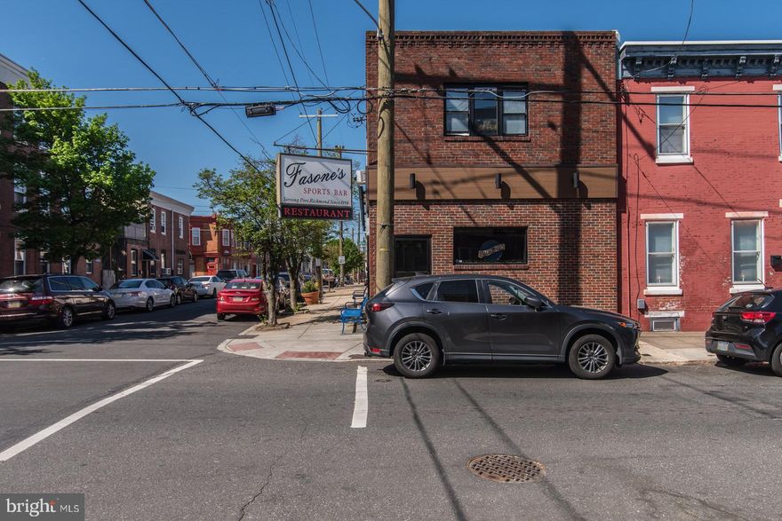 For Sale: Turnkey Bar & Restaurant in the Heart of Port Richmond – 2656 E Ann Street. Located on a prime corner lot, this brick-front commercial gem offers an unbeatable combination of location, functionality, and charm. Step inside to a fully equipped bar and restaurant space, featuring rustic-modern finishes, rich wood accents, and seating that accommodates both intimate gatherings and lively crowds. The bar boasts multiple flat-screen TVs, ceiling fans throughout, high-top seating, and plenty of space for darts, pool, or live music. A fully functional kitchen is ready for operations, complete with commercial-grade appliances, prep areas, and storage. Upstairs, discover a spacious private banquet room with its own bar, ideal for private parties, events, or a potential income-producing rental opportunity. Updated restrooms on both floors add convenience for patrons and staff alike. Additional highlights: Corner visibility with strong foot and vehicle traffic, liquor license included, well-maintained and clean interior, and steps from I-95 and minutes from Fishtown, Bridesburg, and Northern Liberties.  Whether you're an investor looking for a cash-flowing business or an entrepreneur ready to make your mark, 2656 E Ann Street is your opportunity to own and operate in one of Philly’s most vibrant neighborhoods. Schedule your tour today and bring your vision to life in this iconic Port Richmond spot.  Seller Financing Available.