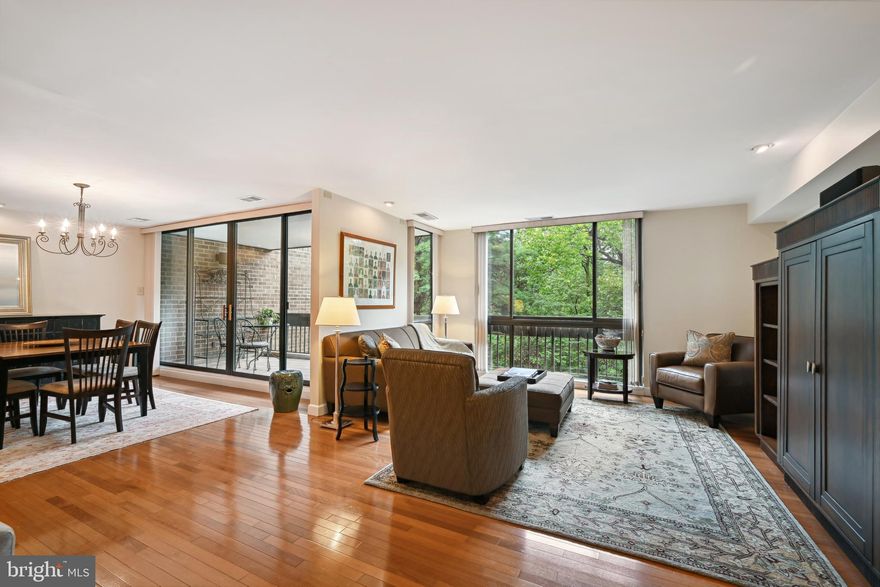 Welcome to the epitome of luxurious living at Sumner Village! This rarely available sun-drenched top-floor 2-bedroom unit is a true gem, boasting a beautifully renovated kitchen, two renovated full baths and an in-unit washer/dryer.  The kitchen is a chef's dream, featuring generous cabinet space, sleek granite countertops, stainless steel appliances, under cabinet lighting, breakfast bar and a convenient pass-thru to the large separate dining room. From the dining room, step out onto the balcony with tiled flooring and be captivated by the exquisite parkland wooded view – a perfect spot for morning coffee or evening relaxation.  As you enter the unit, you'll be greeted by an inviting foyer that leads to the spacious living room, adorned with recessed accent lighting, pristine hardwood flooring, and, of course, those tranquil wooded views.  Both bedrooms offer a serene retreat, complete with recessed accent lighting, ceiling fans, and generous walk-in closet space featuring custom closet organizers. The backdrop of lush woods adds to the peaceful ambiance.  This unit comes with two coveted covered parking spaces and a sizeable storage area conveniently located in the bay next to the building entrance.  Sumner Village is a gated community with 24-hour security, providing peace of mind to residents. Enjoy a host of amenities, including a large pool with a terrace, tennis and pickleball courts, an exercise room, and a party room for all your entertaining needs.  Convenience is at your fingertips with shopping options like Safeway, CVS, Chase Bank, and a variety of restaurants just a short walk away.  Don't miss the opportunity to make this Sumner Village sanctuary your new home. Schedule a viewing today and experience the perfect blend of elegance, comfort, and convenience!