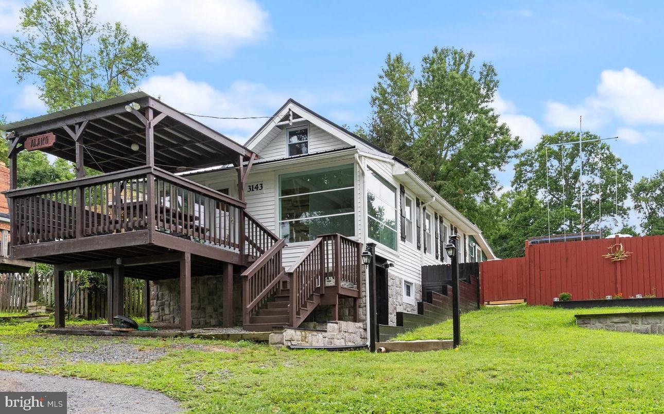 Welcome to the "Beach Farm" house! Located in the desirable Kenwood Beach Community and only 1 block to the beach and the Chesapeake Bay. You will experience breathtaking water views from almost every room, on both decks, and even sitting by the fire pit! These amazing water views are complemented by custom finishes throughout. Updated from top to bottom. The beautiful white siding and elegant stone foundation is the perfect contrast to the custom black wood shutters and the new black metal roof. Just in time for summer parties, cookouts, fun at the beach (look for shark teeth), fishing and crabbing on the pier or take your boat out on the water! Then jump in your golf cart and head back to the house to your very own Tiki Bar on the back deck! Have a drink while admiring the view of the Bay. The covered front deck features built-in seating and a picnic table that's perfect for playing board games or eating crabs; and of course, the water views. As you enter the home you will immediately notice the pouring of natural light. The master bedroom has floor to ceiling windows facing the Bay with the perfect water view. The main level also features a 2nd bedroom, living room with a wood burning stove, a full bath, and completely updated kitchen. Every door in the home along with the kitchen shelving has been custom made. The thoughtful and high-quality updates in this renovated home reflect the seller's clear dedication to detail. The finished lower level features a bedroom, full bath, laundry room, and a walkout side door. The upper level features a huge loft space that can sleep extra guest staying for a beach weekend, or can be used as the 4th bedroom. The home sits on a double lot with the backyard being fully fenced in, and room for gardening in the side yard. The seller strategically built the fire pit so you can enjoy the water view sitting by the fire. Live like you are on vacation everyday! Or make this a great Air BNB. This home is turn-key and a MUST SEE! HOA is voluntary and only $160 a year. Don’t wait, schedule your showing today!