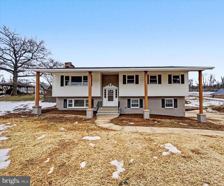 Welcome to 4092 Manchester Street in Glen Rock, located in the Southern York County School District. This beautifully renovated bi-level home has just received a top-to-bottom makeover and is ready for its new owners. Major updates provide peace of mind, including a brand-new roof, new septic system, new HVAC system, updated electric, and numerous additional improvements throughout. This home offers generous living space along with thoughtfully designed storage options. The main level features a spacious living and dining room combination that flows seamlessly to the rear deck and patio, creating an ideal setup for everyday living and entertaining. The brand-new kitchen is a standout, complete with custom cabinetry, quartz countertops, ceramic tile backsplash, and stainless steel appliances. The fully renovated bathroom showcases classic wainscoting and a beautifully tiled tub and shower surround. Three nicely sized bedrooms complete the upper level. The lower level offers a large second living room highlighted by a substantial woodstove, perfect for cozy evenings. A convenient half bath and laundry area are located just off the two-car side-load garage, adding functionality and ease. Enjoy peaceful views of the surrounding countryside while benefiting from a rural setting that remains conveniently close to I-83 for an easy commute. This property qualifies for 100% USDA no-money-down financing for eligible buyers and also offers flexible seller financing options, providing unique opportunities for those who may be self-employed or working to strengthen their credit profile. A rare combination of modern updates, space, scenic views, and flexible financing makes this home a must-see.