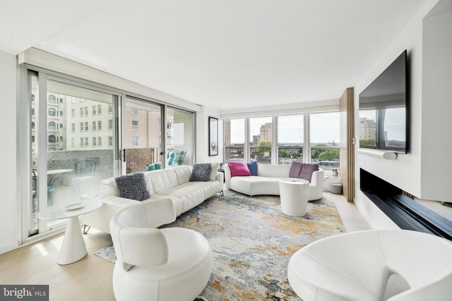 MILLION DOLLAR BREEZE and VIEW! Welcome to luxury living on Rittenhouse Square! This exceptional combined unit, originally boasting three bedrooms, has been thoughtfully reimagined into a spacious two bedroom plus office and  two balcony retreat.  This large unit also includes:  two walk-in closets; expansive open concept living, dining, and kitchen areas; stunning primary bedroom; and separate laundry room. 
Step inside and be greeted by a meticulously renovated space, where no detail has been spared. The kitchen, living, and dining areas have been completely gutted and redesigned with an open-concept layout. The aqua vapor fireplace and hardwood floors grace the entirety of the space, complementing the contemporary aesthetic.
Natural light floods in through new windows, enhancing the bright and airy ambiance. As a corner unit, this home benefits from dual exposures to the east and south, offering breathtaking views of Rittenhouse Square and the surrounding cityscape. Enjoy the beauty of the square from the comfort of your own home, with Rittenhouse Square-facing windows inviting the outdoors in.
Two balconies provide additional opportunities for outdoor relaxation and entertainment, with one overlooking Rittenhouse Square and the other accessible from the south-facing bedroom windows. Whether you are  savoring morning coffee, taking in the City lights or watching the sunset, these private outdoor spaces offer a tranquil retreat in the heart of the city.
This exceptional property combines sophisticated design, premium finishes, and an unparalleled location, offering a rare opportunity to experience luxury living in one of Philadelphia's most coveted neighborhoods. Don't miss your chance to make this urban oasis your own! All utilities included in condo fee, including basic cable. Pool Club and valet parking are available at an additional fee.