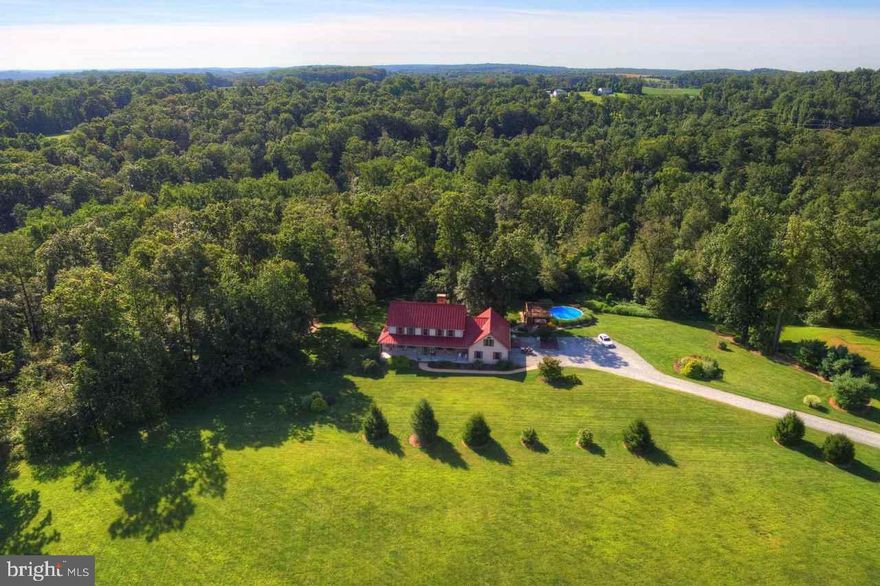 On this 46+ acres of privacy, you will find a custom-built home w/ 9' ceilings.  1st flr MBR & BA.  1st flr LAU.  Beautiful FR FP & more!  Mostly wooded w/ a stream & great hunting.  Would make a nice farm w/ a cleared site for a barn/stables.  Taxes shown are incorrect.  Clean & Green taxes are $8,000/yr total.