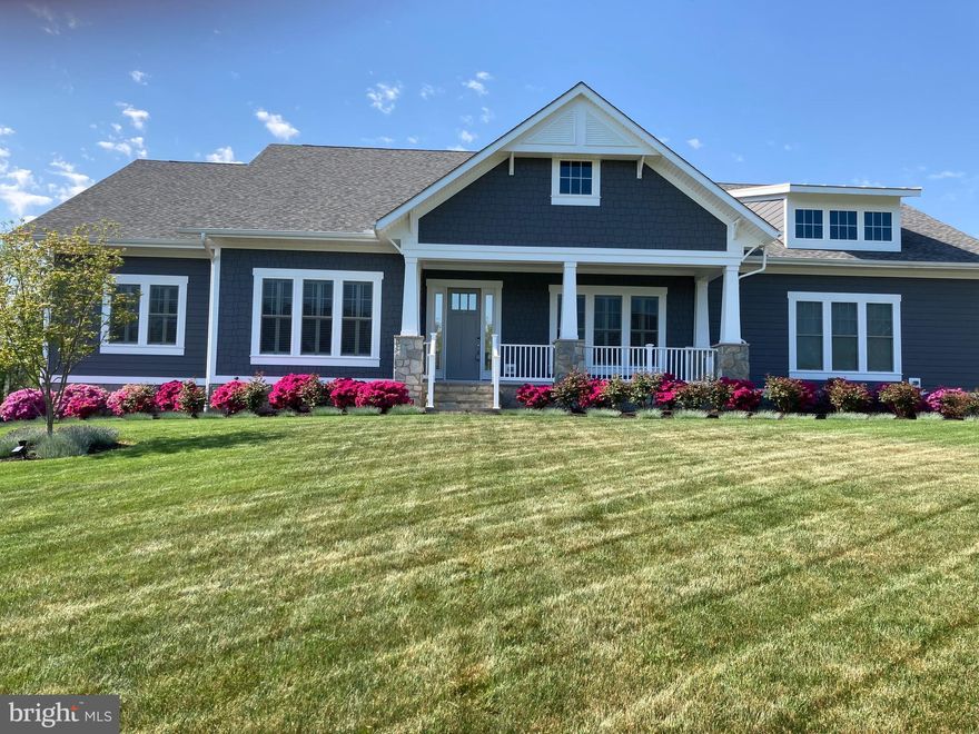 Elegant estate in The Grant at Willowsford, featuring unparalleled quality on an incredible .72 acre lot. This Bayshore model with one level living has 5 bedroom​s​ and 5.5 baths.  It has a truly grand feeling with 10-foot ceilings upstairs and an 11’ inset coffered ceiling in the great room. Decorative moulding and plantation shutters add to the elegant feel.  Engineered hardwood floors throughout the great room, dining room and office/bedroom. The finest of features include a beautiful ​and spacious ​morning room with ​an elegant brushed nickel light fixture and ​windows on 2​ walls​​. The gorgeous gourmet kitchen boasts ​white Aristocrat cabinetry, ​a beautiful gray/white marble back splash, ​stainless steel appliances, an oversized quartz island, Thermador cooktop, Subzero refrigerator and Bosch dishwasher.  In the great room, enjoy a floor to ceiling stone gas fireplace. ​The large Anderson windows and sliding doors provide an open view to the covered porch and back yard. ​Both the laundry room​ and ​mudroom are conveniently located near the 3 car garage. Main level living at its finest with an opulent owners suite featuring a luxury bathroom that includes a frameless glass shower with dual shower head and cobblestone floor, a free standing M​AAX​ tub, and beautiful spa lighting. The built-in closets, one including a second laundry, complete this magnificent space There are three additional generously sized bedrooms including upgraded, en-suite bathrooms and walk-in closets. The fully finished lower level with luxury vinyl plank flooring is an incredible space for family and entertaining. It offers a huge recreation room for family fun. Two separate areas are perfect for storage, home gym, wine cellar or private theater. The 5th bedroom and full bath make it perfect for family members or guests to have their own private space. ​Two Rinnai tankless hot water heaters are great energy savers. ​The backyard and outdoor area is an incredible year-round paradise. Enjoy the 16’x26’ covered slate porch with custom planter boxes and lattice.  Extensive trees have been planted to increase privacy. Centrally located near all that Willowsford has to offer! This sought after neighborhood includes 2 meeting spaces (the ​L​odge and the Sycamore House),​ 2 large outdoor pools,​ a pond for fishing and kayaking, lots of wooded trails and an organic farm that offers produce at the weekly farmers market. Quick access to commuter routes, shopping, businesses, and just minutes from future metro. A wonderful opportunity to own an excellent property in Loudoun County. Schedule your tour today!