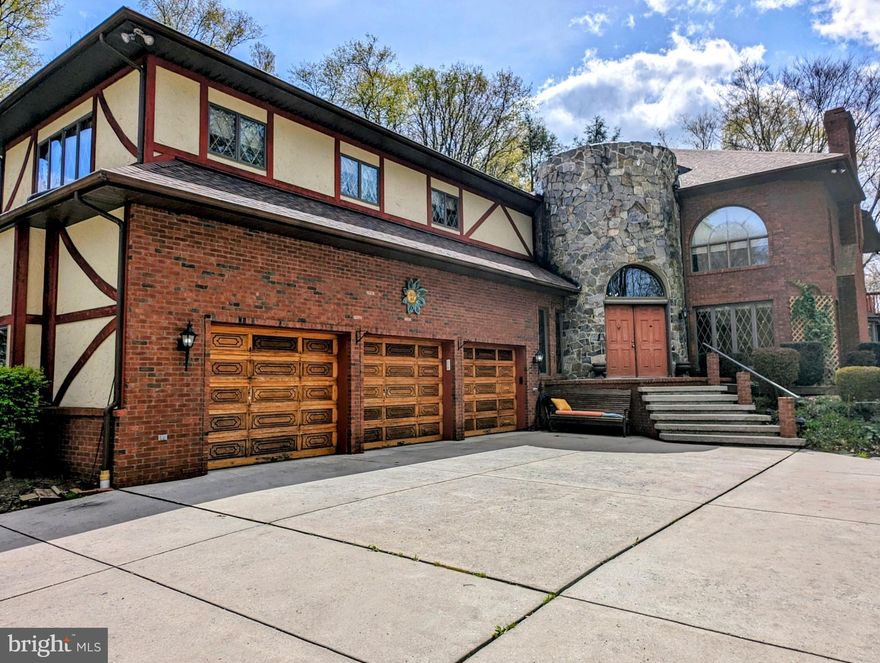 This absolutely stunning English Tudor, situated on a private 11+ acres, is calling you home! A winding private drive through the woods welcomes you to this one of a kind home. Boasting over 6,000 sqft of finished living space this home has plenty to offer every buyer. The front entrance takes you through the 2 story stone turret foyer and into the main living areas. The heart of the home lies in the expansive living room, where a grand stone fireplace serves as a focal point for gatherings. A gourmet kitchen overlooks the living room, with granite counter tops, counter seating, subzero refrigerator and freezer, wall ovens and induction cook-top. Adjacent, the formal dining room is ideal for having the entire family over for dinner. After dinner there is more fun for everyone with the finished lower level bar and game room, perfect for entertaining. Retreat to the spacious master suite, featuring an over-sized soaking tub, large tile shower and dual separate vanities and walk-in closet. Each additional bedroom offers ample space for family and guests, each thoughtfully appointed and with generous closet space. A large 3 car attached garage offers plenty of parking and even more space is available for your extra toys in the detached 4th garage bay. Enjoy comfort and efficiency with geothermal heat pumps, multiple backup heat sources as well as a brand new roof with transferable warranty. Outside there is so much to offer, with gorgeous wooded views from multiple decks, flowering trees, gardens and more. A truly special property that is waiting to be your next home!