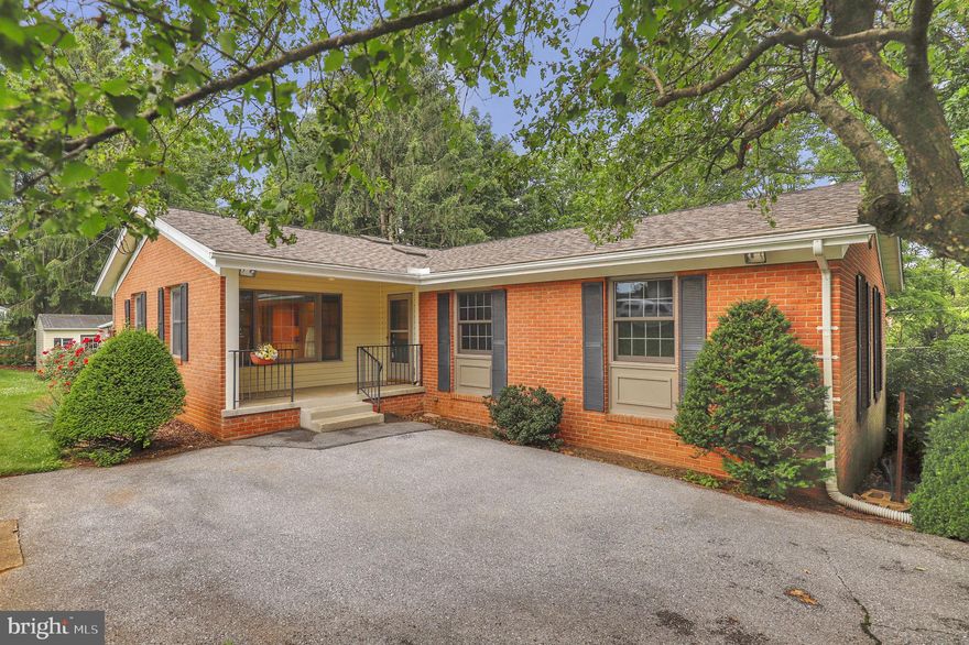 Surrounded by nature and set along a peaceful walking path, this charming nearly all-brick home sits on over half an acre in the heart of Middletown. Major improvements include a new roof (2018), water heater (2023), and AC system (2022). Lovingly maintained by the original owners since 1966, this 3-bedroom, 2-bath gem offers 2,055 square feet of above-grade living space and thoughtful updates throughout. Enjoy hardwood floors in the kitchen, dining, living and family room areas, a cozy wood-burning fireplace, updated appliances, oil heat, and a layout filled with natural light.  Plus a walk around deck off the sunroom takes you to the back yard. Walk to Middletown schools, the library, and local shops—all just minutes away. No HOA and no garage, but rich in character and location. Home is being sold AS IS.
