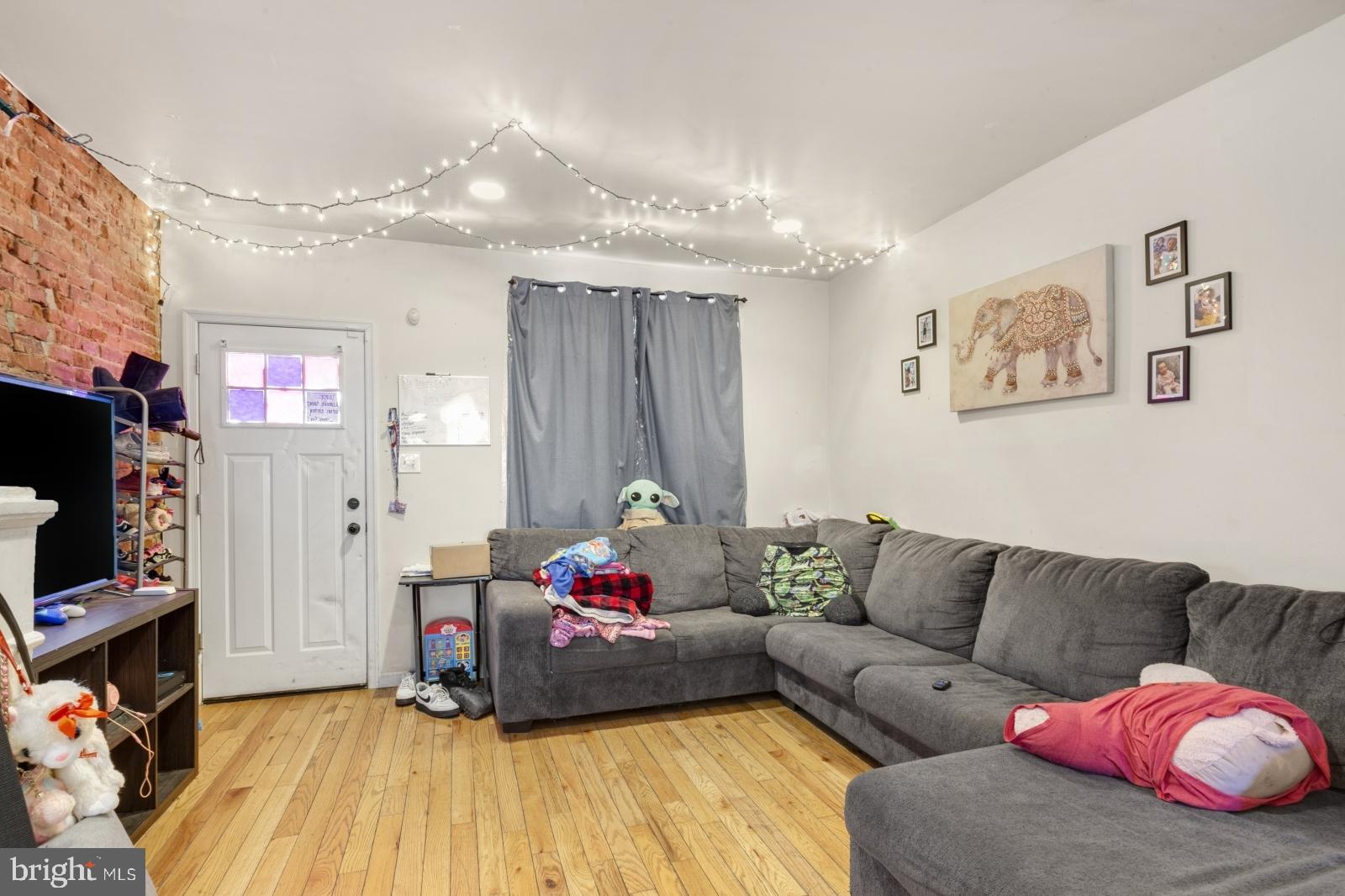 Welcome home to 1921 S. Bonsall Street. This spacious rowhouse is on a quiet side street situated between the vibrant W. Passyunk and Newbold neighborhoods. Enter through the front door into your large open concept living room, dining room, and kitchen. The straight thru design allows for a variety of furniture setups and is perfect for entertaining. A private rear patio is off of the kitchen and the unfinished basement is great for storage. Upstairs, there are two medium sized rooms towards the rear and middle of the house which both have exposed ductwork giving them a modern and industrial feel. The primary bedroom is at the front of the property with two large windows. The full bathroom has tiled shower/tub, porcelain sink, and large window allowing for natural light and fresh air. Walkable to some of Philly's favorites like Caffe Ida, South Philadelphia Tap Room, and Second District Brewing. Easy access to major highways and bus routes. This home is not to be missed!