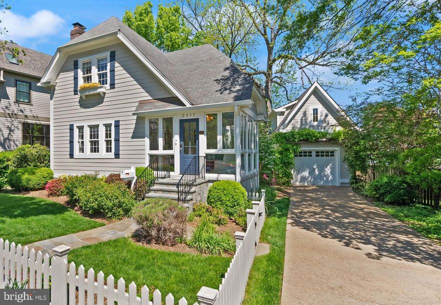 **Offers Due Monday, May 5 at 6pm**  Lyon Village Cottage, designed by Deborah Blair, is a stunning five-bedroom, three-and-a-half-bathroom home that has been thoughtfully customized from top to bottom. A charming white picket fence and professionally landscaped garden create a welcoming first impression. Enter through the sunroom, featuring a custom-painted cement floor, Stark Rustic sisal cut to fit, and solid brass dog hooks for leashes. Throughout the home, Farrow & Ball paints complement custom color-finished hardwood floors, handmade solid brass and crystal doorknobs, and an overall attention to artisanal detail. >> The open-concept main level boasts a cozy living room centered around the fireplace, and a dining room with matching hand-blocked Galbraith & Paul linen Chinoiserie-style light fixtures by Urban Electric. Windows are dressed in custom Belgian linen-cotton blend treatments with Brimar Border trim. The space is anchored by handmade wool rugs and a stair runner by Elizabeth Eakins/Holland & Sherry. A spacious kitchen includes stainless steel appliances and a UK-style handmade antiqued freestanding pantry. This level also includes a powder room and laundry room for convenience. >> Upstairs, the three bedrooms are each appointed with Stark wool carpeting cut to fit, custom window treatments by Carleton V and Elizabeth Eakins, and elegant ceiling fixtures by Colleen & Co. A large Visual Comfort fixture graces the hall, while the bathroom features a custom-sized and color-matched light fixture by Hwang Bishop.  >> The expansive lower level, with its own private entrance, includes a full kitchen and bathroom. It is finished with Sanderson and Cowtan & Tout wallpaper and Stark wool rug cut to fit. >> A serene retreat awaits in the carriage house above the garage. This charming space includes a morning kitchen, full bathroom, Skyler Samperton wallpaper, Cowtan & Tout window treatments, and Stark carpeting. >> The oversized garage is equipped with a Tesla EV charger and features an arbor draped in wisteria. The backyard offers a beautiful slate patio, grassy lawn, mature plantings, and an irrigation system. While this home may make you never want to leave, you’re just two blocks from the vibrant shopping, dining, and Metro access in Clarendon.