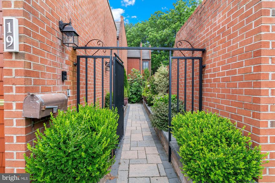 Welcome to 19 Coldwater Court, a rare gem tucked away in one of Towson’s most sought-after enclaves. This exquisite end-unit townhome exudes luxury, space, and unparalleled privacy—offering the feel of a single-family home with the ease of townhome living. From the moment you arrive, a charming private entry courtyard welcomes you, setting the tone for the refined elegance that awaits inside. Perfectly positioned at the end of a quiet court, this residence is enveloped by lush landscaping, creating a peaceful retreat just moments from the vibrant heart of Towson. Step inside to discover a light-filled oasis where sophistication meets comfort. The centerpiece of the main level is a breathtaking solarium-style living room, crowned with soaring ceilings and an expansive wall of windows that flood the space with natural light. Gleaming hardwood floors, a cozy fireplace, and seamless flow to an oversized deck make this the ultimate setting for both grand entertaining and intimate gatherings. The gourmet kitchen is a chef’s dream, featuring high-end appliances, granite countertops, custom cabinetry, and an inviting breakfast nook that overlooks the serene courtyard. Every inch of this home speaks to thoughtful design and quality craftsmanship. The luxury extends to the lower level with a fully finished, walk-out basement offering flexible living space—ideal for a family room, home theater, or guest suite—all opening to a private patio and landscaped grounds. Upstairs, spacious bedrooms provide a restful escape, including a lavish owner’s suite with spa-inspired bath finishes and ample closet space. Throughout the home, custom details and designer touches abound, elevating everyday living into something extraordinary. Located just minutes from Towson’s best shopping, dining, and entertainment, yet tucked away in a tranquil setting, 19 Coldwater Court offers the perfect balance of convenience and seclusion. Whether you’re seeking a private sanctuary, a luxurious entertaining space, or the perfect place to call home in one of Baltimore County’s most desirable communities, this stunning residence delivers on every level.