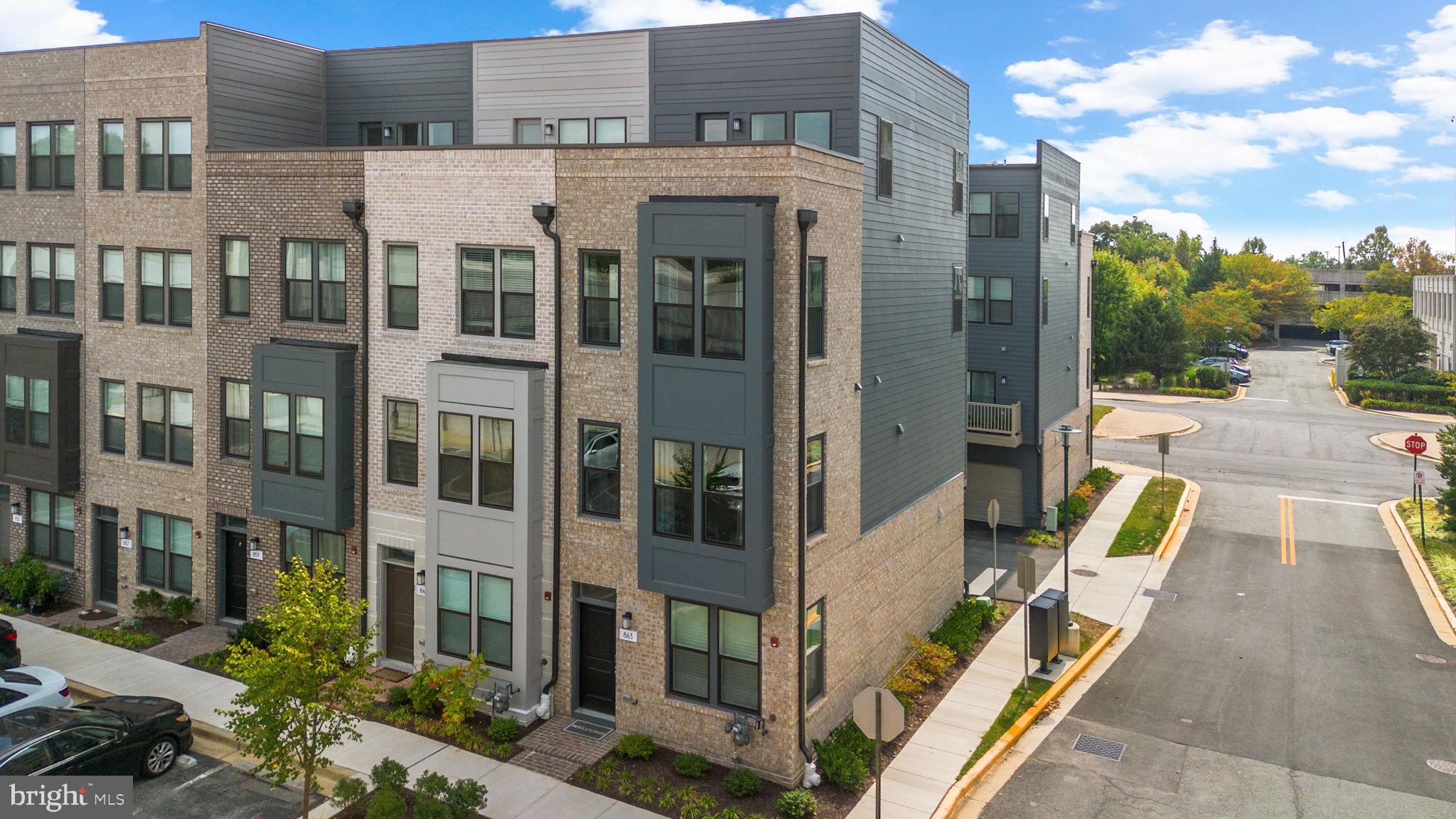 Just Built in 2024 – End-Unit Modern Townhome in King Farm!****
Welcome to 863 King Farm Boulevard— ***BE SURE TO VIEW THE VIRTUAL TOUR TO SEE THE VIDEO TOUR, 3-D TOUR, AND INTERACTIVE FLOOR PLANS*** — a stunning, newly built 4-level end-unit townhome offering the perfect blend of modern luxury and urban convenience in the heart of Rockville’s highly desirable King Farm community. This stylish residence features an open-concept layout with a massive center-island gourmet kitchen, designer finishes, and an elegant electric fireplace that anchors the main living space.****
Boasting 3 spacious bedrooms and 3.5 beautifully appointed bathrooms, this home offers flexibility and comfort on every level. The top floor includes a large family room and access to a rooftop deck—ideal for entertaining or relaxing under the stars. The 2-car tandem garage provides ample parking and storage.****
Enjoy access to two community recreation centers, complete with pools, parks, and walkable shopping and dining. With quick access to I-270, I-370, MD-200, and the Shady Grove Metro, commuting is a breeze.****
Don’t miss this rare opportunity to own a nearly brand-new, move-in-ready home in one of Rockville’s most vibrant neighborhoods!