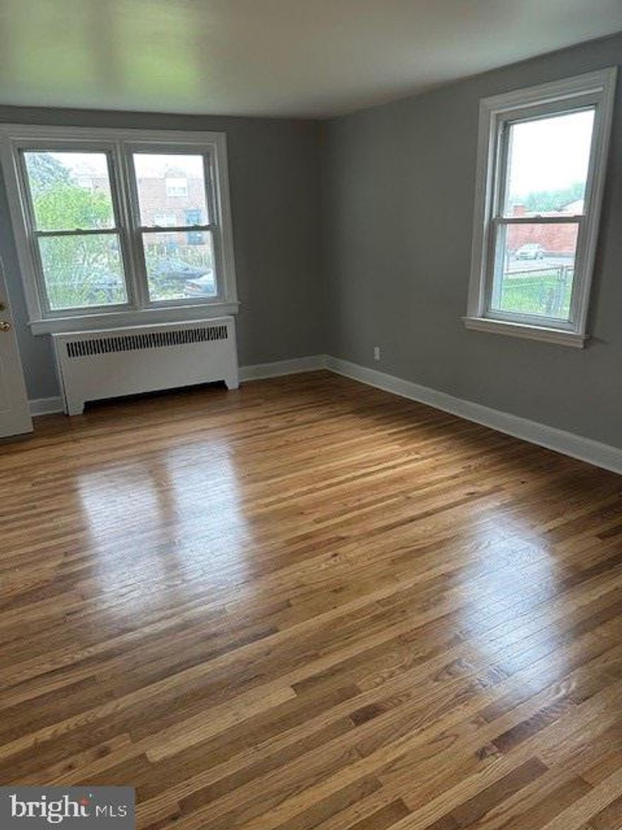 Recently renovated 1st floor unit; modern kitchen with shaker style cabinets, freshly refinished hardwood floors, freshly painted, washer and dryer in basement, shared 2 car garage with upstairs tenant. First month's rent, last month's rent and security deposit due at signing of lease.  2 Bedroom Section 8 Voucher is possible or good credit and employment history.