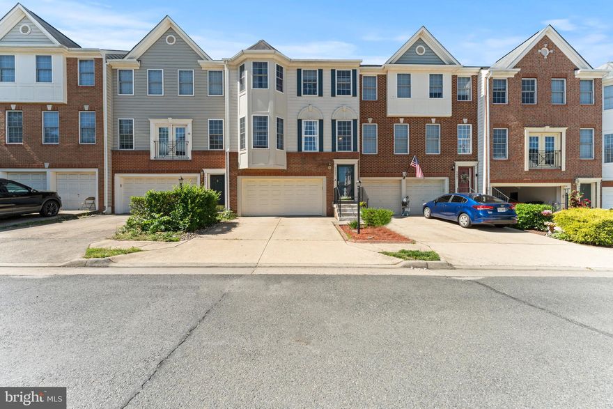 This  impressive 3-level townhome boasts over 2,700 square feet of beautifully designed living space. From the moment you step inside, you're greeted with sun-soaked rooms, gleaming hardwood floors, and an open floor plan that flows effortlessly for both entertaining and everyday life.

The heart of the home is the chef-inspired kitchen, featuring Corian countertops,  white cabinetry, and a large breakfast bar perfect for morning coffee or evening cocktails. The adjacent sunroom invites light and relaxation, while the expansive living and dining areas offer elegance and flexibility. Cozy up by the gas fireplace—perfect for chilly evenings.

Upstairs, the spacious owner’s suite is a true retreat with his and hers walk-in closet and a spa-like bath, while two additional bedrooms and a full bath provide ample room for family or guests.

Need more space? The fully finished walkout basement includes a large rec room, half bath, and access to the fully fenced backyard, ideal for pets, play, or private gatherings. Plus, enjoy not one, but two decks—perfect for grilling or lounging.

With a 2-car garage, peaceful wooded views, and proximity to shops, dining, major commuter routes, and the VRE, this home blends comfort, convenience, and community.

Don’t miss the chance to call this one “home.”