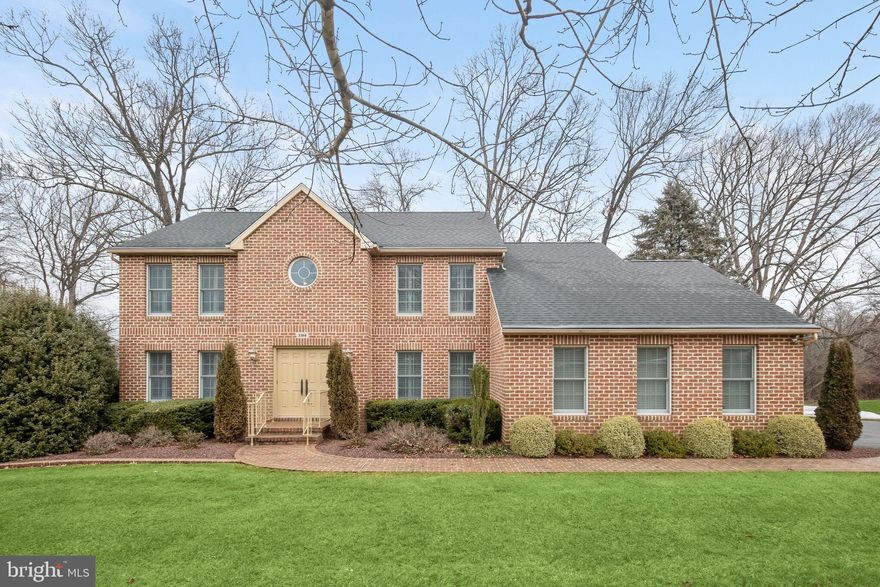 Nestled within the prestigious River Downs Community, this exceptional all-brick colonial home stands as a testament to timeless elegance and meticulous craftsmanship. The oversized hand-made bricks create a distinctive exterior, showcasing the rarity of an all-brick design within the community. Situated on a sprawling 2-acre lot, this residence offers a perfect blend of privacy and natural beauty. Majestic trees provide a serene backdrop that overlooks the lush Fairway of the renowned River Downs Golf Club. With a seamless integration of indoor and outdoor living, the expansive deck spanning the length of the house beckons for relaxation and al fresco dining. Step through the 2-story foyer, adorned with refinished Kentucky hardwood flooring with a patterned inlay, into a home meticulously maintained and updated by its original owner. The recently renovated kitchen by Stuart Kitchens is a culinary haven, featuring custom soft-close cabinetry with undermount lighting, quartz counters, a travertine backsplash, and stainless-steel appliances. The kitchen also features a distinctive quarter-sawn oak island, not only serving as a captivating centerpiece but also offering wonderful storage space. Elegance abounds in the formal living and dining rooms on either side of the foyer, boasting crown molding and custom plantation shutters that are featured throughout much of the home. The family room, illuminated by Palladian windows, centers around a wood-burning fireplace with a distinguished Princeton wall system. The neighboring study, equipped with built-in bookcases and lateral file folder storage, offers a conducive space for focused work or leisure. Convenience meets functionality with the main-level laundry room, complete with a utility sink, providing a seamless blend of practicality and ease. The upper level hosts a primary bedroom with custom detailed ceiling trim, a 13-foot walk-in closet, and an en-suite bath with a soaking tub and tiled shower. Two additional bedrooms, each with a private bath, complete the upper level, all recently carpeted. The lower level unfolds as an entertainment oasis, with a meticulously designed wet bar featuring high-end custom cabinetry, granite counters, microwave, full size refrigerator, and a Bosch dishwasher. The lower level gracefully opens to an extended patio, stretching the entire length of the house and adorned with a matching brick border. This outdoor space not only offers a delightful retreat but also boasts a private and picturesque view akin to the deck above. Furthermore, a bonus room on the lower level, featuring an attached bath, presents the potential for a guest suite, with the private entrance accessible from the patio. Additionally, a finished storage room on this level adds to the functionality of the home. Practicality meets luxury with an oversized side-loading 2-car garage with epoxy flooring, providing ample storage space. The roof, replaced in 2014, and the updated HVAC systems ensure worry-free living. The seller's attention to detail is evident, with removal of all artwork from the walls and meticulous touch up painting for a fresh appearance. Embrace the lifestyle of River Downs with access to the golf course, driving range, clubhouse, and restaurant. This residence epitomizes gracious living in a sought-after community, offering a harmonious blend of classic charm and modern amenities.