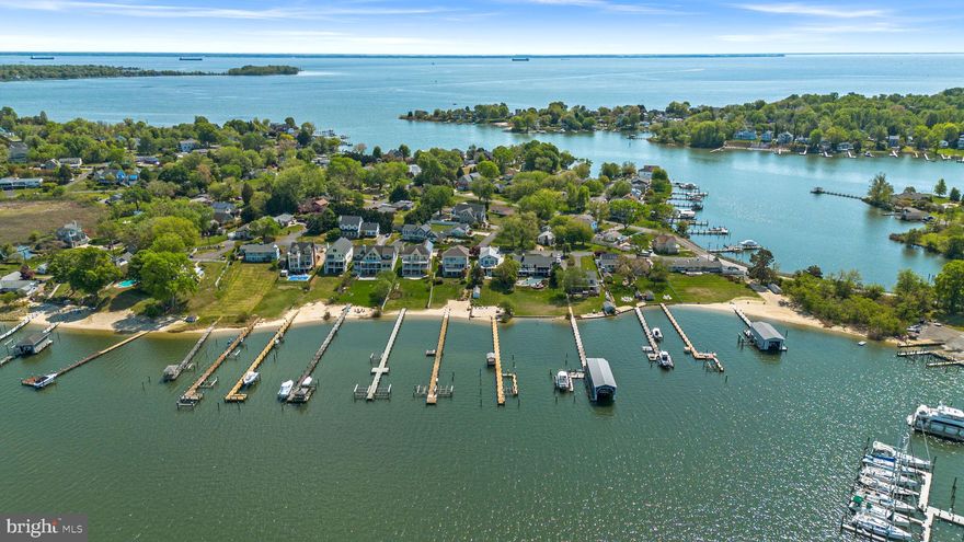 Waterfront living in Edgewater awaits at 3728 Bay Drive! This inviting home offers sweeping bay views, a private beach, and a spacious backyard perfect for entertaining, play, or peaceful relaxation by the water. A charming screened-in deck overlooks the bay, providing an ideal setting to enjoy sunsets and cooling evening breezes. Don’t miss this rare opportunity to experience true waterfront living at its finest.