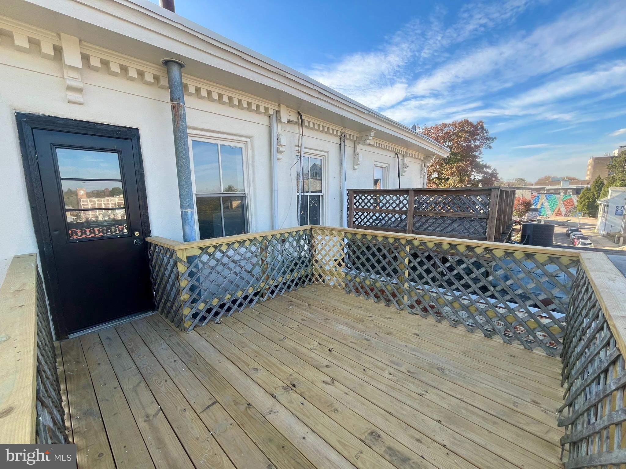Located in the heart of Germantown, this newly renovated 2-bedroom apartment sits just above the beloved Uncle Bobbie’s Coffee & Books and offers a mix of original charm and modern updates. Perched on the third floor with a rear-facing private deck, this unit boasts central air and a versatile, open layout that is filled with natural light. The main floor features a spacious living and dining area with new flooring, high ceilings, and oversized windows that frame stunning views of historic Germantown Avenue. The brand-new kitchen features stainless steel appliances, quartz countertops, a sleek over-the-range hood, and a convenient dishwasher. The updated bathroom is outfitted with stylish tile, a contemporary vanity, and modern fixtures. A spiral staircase leads down to the charming second bedroom on a lower level, creating excellent separation between the two bedrooms. With ample closet space and an intercom system, this unit ensures both comfort and convenience. The private deck serves as a peaceful retreat with a scenic view of Germantown’s historic architecture.. There's laundry on the ground level and access to the People's Garden at the rear of the property. Embrace the neighborhood's rich heritage with the Germantown Historical Society right across the street. Savor the flavors of local produce at the Germantown Farmers Market every Saturday, right from your doorstep. Explore the cultural gems of Germantown, such as the Lest We Forget Museum of Slavery, the People's Lot, Dresher-Morris House, Grumblethorpe, and the charming Maplewood Mall. In close proximity to esteemed institutions such as Germantown Friends School, the Waldorf School and other local charter schools. Within walking distance, you'll find an array of shopping options, restaurants, cozy cafes and galleries. The public library, the post office, banks and more at your fingertips. For the nature enthusiast, Historic RittenhouseTown and the Wissahickon are a short distance away. Commuting is a breeze with the 23 bus route at the corner, connecting you to Chestnut Hill, Center City and Wayne Junction train station, for a quick ride Temple University, 30th St. and Market East Stations. A short drive to Route 76 and the PA/NJ Turnpike, for a trip to NYC and surrounding suburbs.