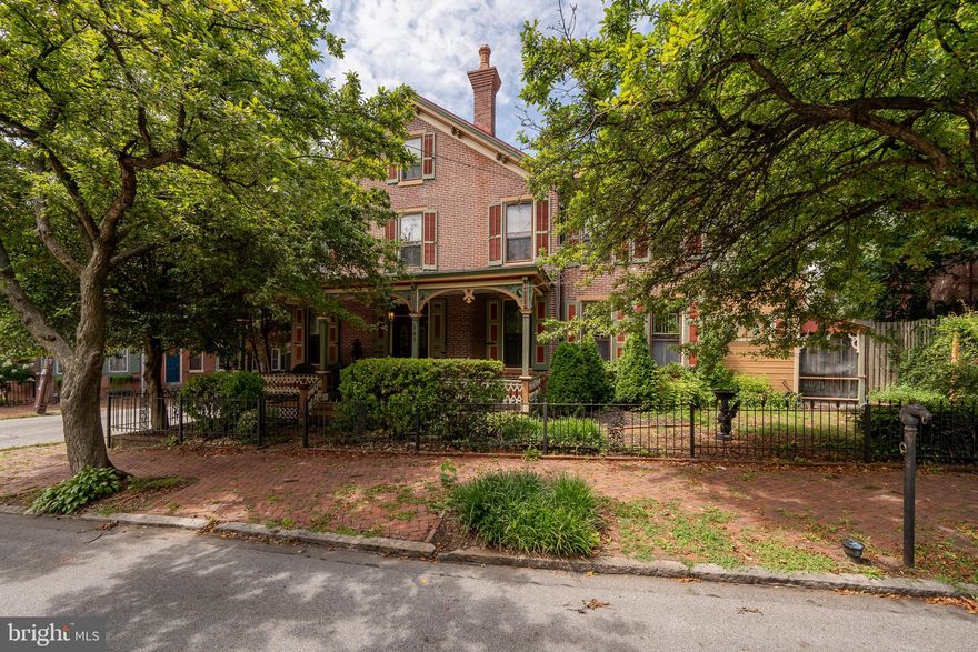 This Victorian  twin is a step back in time to enjoy the old-style charm of this home. Custom wood blinds, refinished floors, and wood trim throughout the house. Stain glass windows, charming & welcoming front porch, fenced-in yard, stainless steel appliances, granite countertops, features 4 bedrooms 2.5 baths, and basement provides plenty of storage space. Also included in this property is a detached 2-car garage a short walk away located at 425 S. Darlington Street. 24-hour notice for Showings. A short walk to all the downtown of West Chester amenities. 7 Star HSA Home Warranty provided to the Buyer.