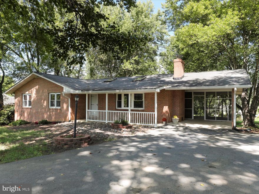 SINGLE LEVEL LIVING  in as established neighborhood! Welcome to 129 Larkspur Ln,  a 3 Bedroom 2 bath all Brick home nestled on a one acre lot in the Steamboat Run community.  The high ceilings and skylights provide natural light while the fireplace in the Livingroom is great for cozy winter evenings. The neighborhood known for its beautiful river access, allowing residents to enjoy kayaking, fishing, or simply relaxing by the water. - perfect for nature lovers. The community offers picturesque walking trails, perfect for morning strolls. This  home offers a perfect blend of serene country living offers   so much all with in minutes from restaurants, shops and Shepherd University.  Being Sold As is