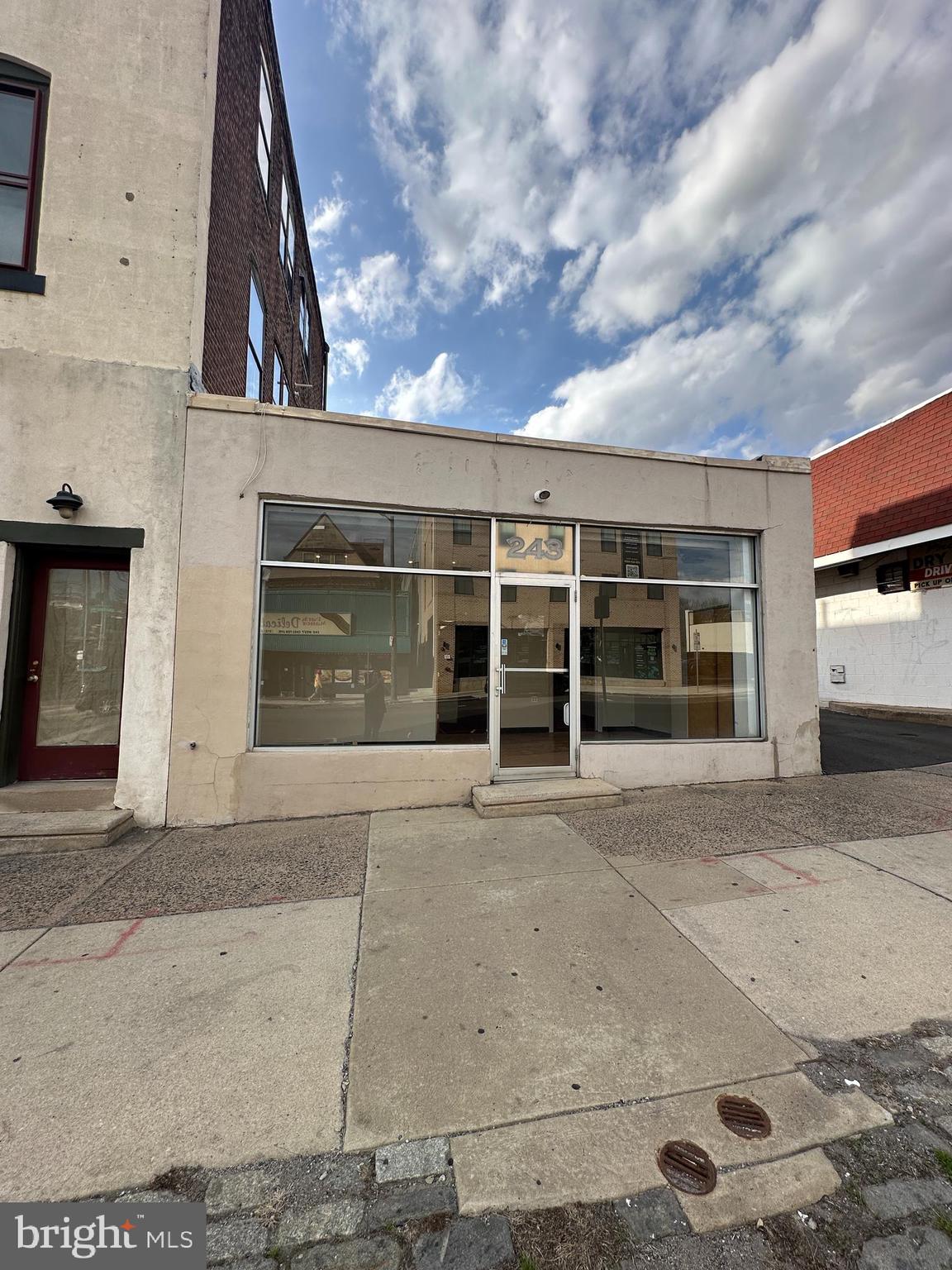 Large Commercial space located in the heart of Historic Germantown off of W. Chelten Ave. and Pulaski. This space is near other commercial spaces and the corner of a busy intersection with lots of foot traffic, street visibility and a 10-15 space shared parking lot in the rear. Located just minutes away from all forms of transportation (26, 53, J and Chestnut Hill West Line) , which allows for an easy and convenient commute to Center City, Chestnut Hill and various other areas. Inside the 1500 sq. ft. space are 5 rooms and a bathroom. Upon entering the front door there is a large open space that leads to a master office and three smaller office spaces, and a half bathroom. Electric, Gas and Water is paid by tenant. Other rental units available for a similar price. Please inquire. The space has previously been used for a Karate Studio, Dental office and Pharmacy. Handicap accessible.