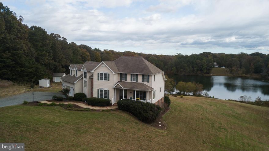 Open Saturday 5/18 1pm to 3pm*Unique angled design taking advantage of pond views*4 bedrooms, 4.5 baths and 5735 square feet finished on 3 levels*Sits on 10 acres of rolling terrain that include a portion of the pond*First floor master suite overlooking the peaceful pond view*Laundry chute, master bath with door less walk in shower, jetted tub and dual vanity*All wood floors on the main level*2 story great room with wall of windows overlooking the pond*Well designed kitchen with granite/corian and stainless steel appliances*Full finished walkout basement divided into two main areas sharing gas fireplace*Large recreation room(pool table conveys), well equipped wet bar w/wine cooler and space for a home theater system*Large craft room with extra cabinets for storage*Oversized 3 car garage*Two freestanding sheds, one of which holds the New Holland TC30 tractor which conveys*Dual zone heating/cooling and water treatment system*Remote controlled blinds in many rooms*Dependable WIFI service through VERIZON's fusion system*
