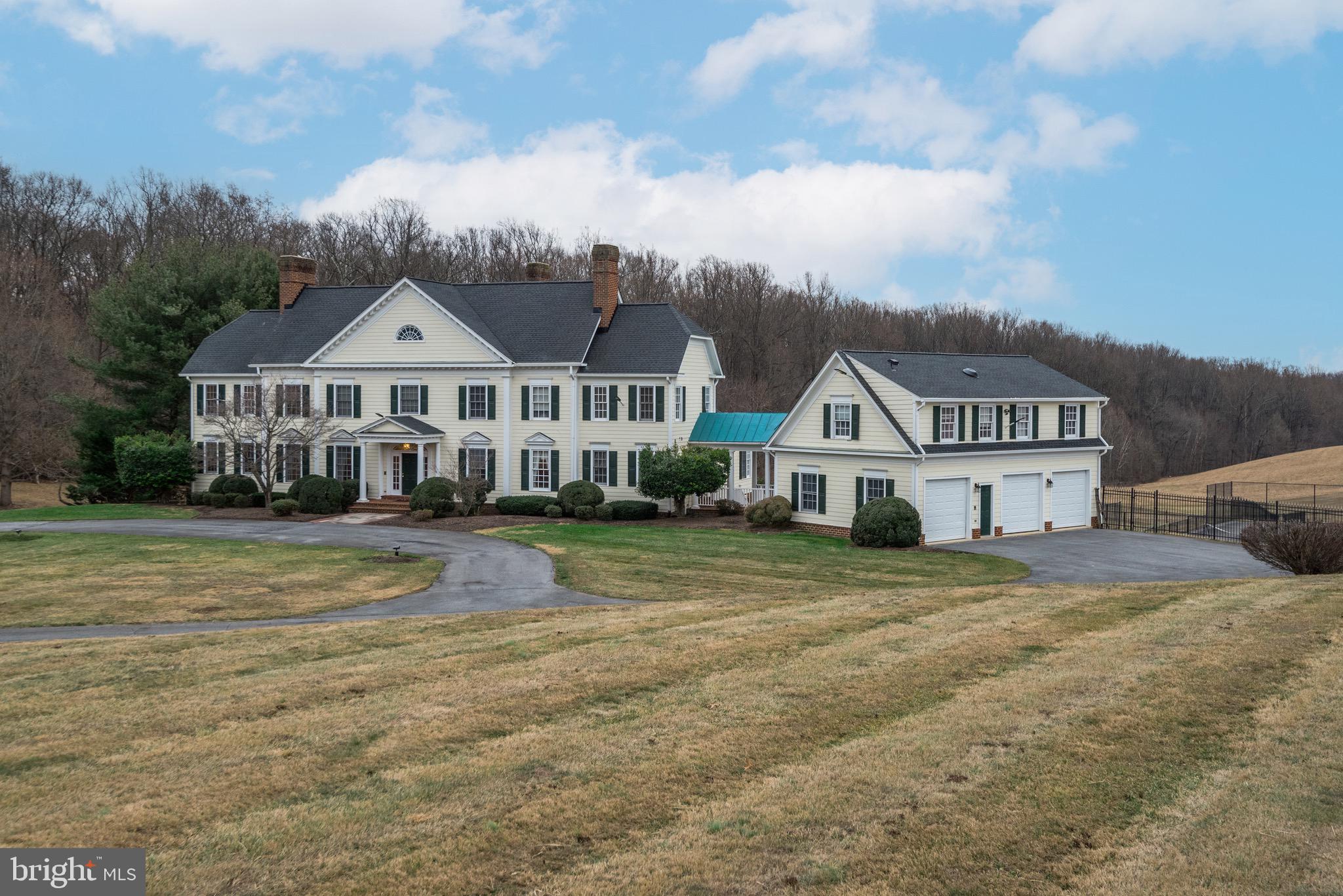 Tucked discreetly behind an arched gate and all fenced along property lines, Exquisite floor plan. Breathtaking home with luxurious upgrades. Formal living and dining rooms offer the perfect backdrop for hosting large gatherings or more intimate occasions. The gourmet kitchen is sure to delight and inspire even the most demanding of chefs with a suite of high-end appliances, including a four-burner gas range. The kitchen opens to a spacious breakfast room drenched in natural light and a large yet cozy family room. Adjacent to the family room, a deck, accessible from the family room, offers a serene outdoor escape. An en-suite private office, conveniently located next to the living room, complete the main level. On the upper level, the thoughtfully designed primary suite is perfect for relaxing in unparalleled luxury and comfort. Two walk-in closets, and a spa-like bathroom. Down the hall, three more generously sized bedrooms await. On the lower level, find an expansive recreation room, card room, lounge, and game room. Do not miss the exquisite theater room, appointed with a top-of-the-line entertainment system and inviting recliners. A private outdoor oasis awaits in the rear of the property with a large yard, perfect for solitude or entertaining and a full tennis court. Whether you are in search of peace or a space for gatherings, horse riding and simply space to entertain, you are sure to find it here. Located moments from wonderful shops and eateries at Potomac Village, with easy access to I-495. Additional House Information: Guest Suite in Carriage House: Bedrooms with ensuite baths, Fully equipped kitchen, powder room and spacious combination Living room space.. Timeless architure and grand interior design. This home is complete with master bedroom suites and spa, deck,tennis court, in-ground swimming pool, 6 fire places,hardwood floors, media room, rec lounge, in-law suite. Gated with entry pad great for in-door/out entertainment,sitting on 5 acres treed pasture.