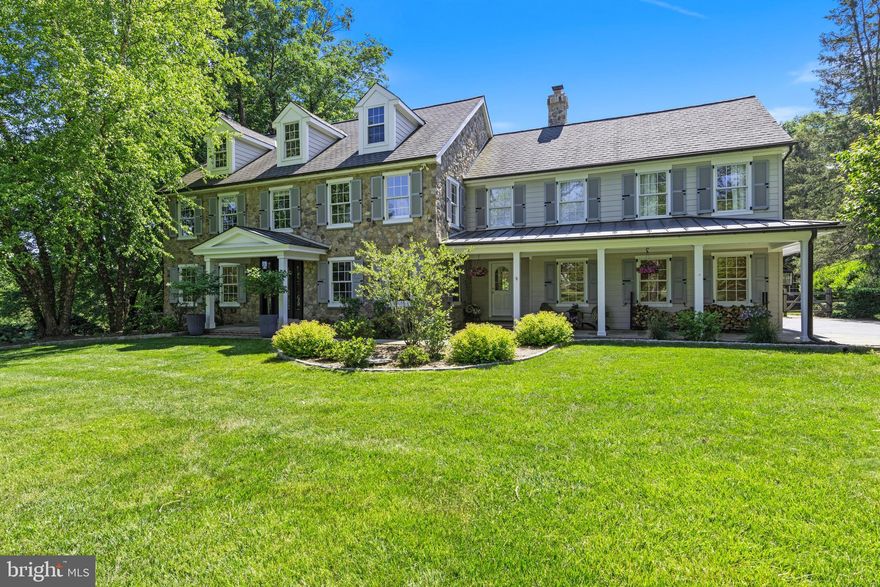 Don’t miss this stunning 4 BD, 4/1 BA classic colonial in the Radnor Hunt area of Malvern. Set on a sweeping 2 acre lot, with outstanding curb appeal, this property offers a perfect balance of privacy and convenience. You’ll love the proximity to shopping and restaurants in Paoli and Malvern, Upper Main Line YMCA, country clubs, prestigious private schools, and the easy 4-minute commute to Paoli Train Station, which offers express rail service to Center City and to NYC. Two covered front porches grace the front of this natural stone and siding colonial, which was gutted and expanded in 2004, and now features over 5,000 s.f. of living space on three levels. The 1st and 2nd floors have neutral paint, crisp white trim, and gleaming Brazilian cherry floors. The Entrance Hall opens to a large Family Room with wood-burning fireplace and to a secluded, private Office, with built-ins. The Office also has a closet, making it ideal for use as a main floor guest bedroom too. The floor plan has great flow for entertaining and is very flexible, offering a variety of options for how spaces are used. Continuing down the hall, you’ll find a second Family Room with a wood-burning fireplace. Soaring ceilings with skylights and wood beams highlight the airy Kitchen, which has abundant cabinet space and a large island with copper prep sink, breakfast bar seating and undercounter beverage fridge and Wolf microwave. Chefs will love the gourmet stainless appliances, which include a gas 48” Wolf cooktop with grill and pot-filler, two dishwasher drawers, and two wall ovens. The exhaust hood and SubZero refrigerator have cabinet-matching wood covers. Enjoy dining in the spacious Breakfast Area or the adjacent Dining Room, both of which have glass doors to the rear deck. A new Powder Room plus a Mudroom with closet, custom built-ins, and cubbies complete the first floor. The generously-sized Primary Bedroom suite has vaulted ceilings and is a true oasis, offering a tranquil escape from the hustle and bustle of everyday life. It features a separate sitting area, ample walk-in closet space, and a Primary Bathroom with soaking tub and huge walk-in shower. An en suite, private Bathroom is also found in Bedroom 2. Bedrooms 3 and 4 share a renovated Hall Bathroom. A large upstairs Laundry Room, pull- down stair access to the Attic, and more closets complete the 2 nd floor. The renovated Lower Level features a Rec Room with built-ins, a TV area, exercise area, 4 th full Bathroom, and additional storage and closet space. Approx. $250,000-$300,000 in upgrades have been added within the past 5 years, including complete exterior renovation in 2022 (full stucco remediation and expert installation of natural field stone and James Hardie siding), new mudroom, new half bathroom, new built-ins, fresh paint, basement renovation, and much more. An expansive, rear Trex deck offers scenic views of the sparkling pool, and beautiful yard. Plus, there is an unexpected bonus… a large Barn which offers loads of storage space, and potential for creating additional living space, a pool cabana area, art studio, or whatever your heart desires! The oversized 3-car Garage also has a dog bath. Located in Willistown Township, in highly ranked Great Valley School District, this home is less than a mile from popular General Wayne Elementary School and offers easy access to Center City, corporate centers, medical centers, and the Airport.