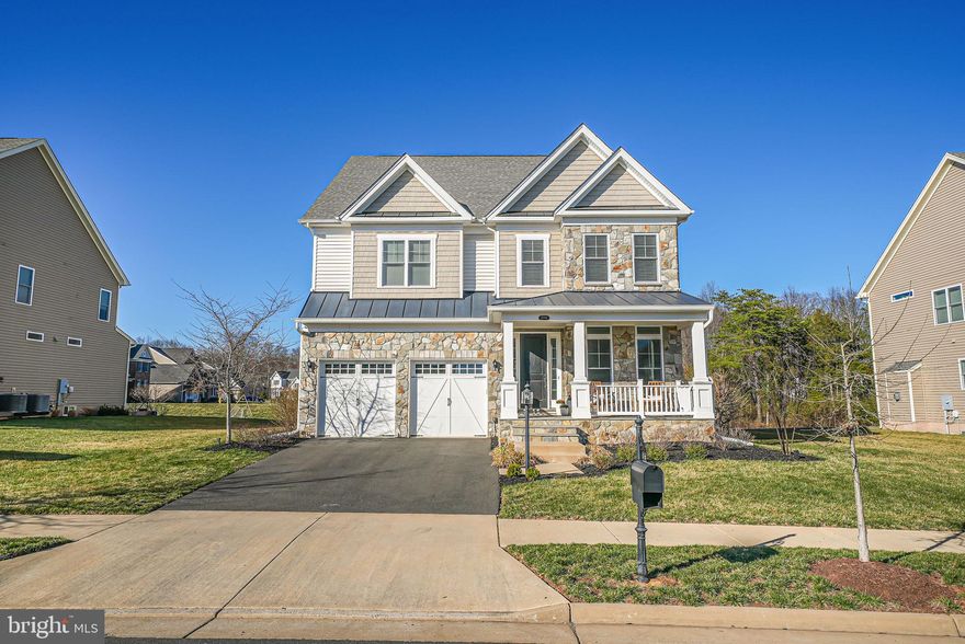 * MODERN. LUXURY. PERFECTION. *

This stunning 4BR | 4.5BA single-family home in Dominion Valley Country Club is the epitome of perfection! Built in 2019, it’s better than new and outshines even model homes, boasting impeccable design and high-end finishes in every room and on every level.

Step inside to a bright, open floor plan filled with abundant natural light—perfect for both entertaining and everyday living. The chef’s kitchen features top-of-the-line cabinetry, an extra-wide quartz countertop, and an open layout that flows seamlessly into the dining room and family room for easy conversation. The dining room offers serene views of the lush, open common area, while the oversized family room with a cozy fireplace creates the perfect space to unwind.

Custom built-ins throughout add both elegance and functionality, including a main-level office, a mudroom/drop zone, and designer light fixtures in every room.

Upstairs, the spacious bedrooms provide comfort for everyone. The primary suite is a true retreat, surrounded by windows with beautiful tree-lined views. Its spa-like ensuite bath features his-and-her walk-in closets and a luxurious oversized shower. A princess suite includes its own private bath, while two additional generous bedrooms share a stylish full bath. Every bedroom boasts a large walk-in closet for ample storage.

The finished basement offers endless possibilities—whether for entertaining, additional living space, a home gym, or more! A full bathroom and extra storage space complete the lower level.

Set on a 0.25-acre lot backing to open green space, this home offers a peaceful retreat perfect for kids, pets, and outdoor gatherings. There's Nothing To Do but  Move Right In!  All this and enjoy all the world class community amenities such as -Arnold Palmer Signature Golf Course, renovated Clubhouse, state-of-the-art Sports Pavilion, 5 swimming pools including an indoor pool, tennis and basketball courts, playgrounds, miles of walking/biking trails and two fishing ponds. 

You have to see this home in person to truly appreciate its beauty.

This is not just a house, THIS IS YOUR FOREVER HOME!