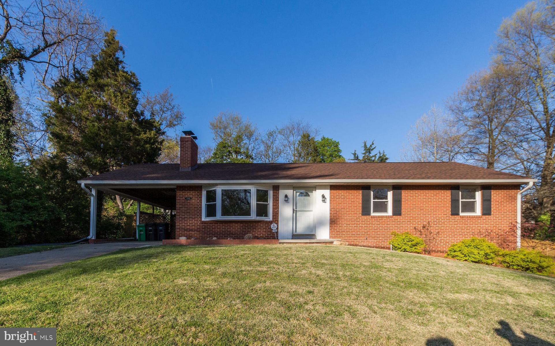 Discover your dream home with this stunning 4-bedroom, 3 full-bath gem, nestled on a spacious corner .35-acre lot. This residence boasts a 3-year-old roof and a covered carport, providing both style and functionality. Step inside to find beautifully refinished original hardwood floors and freshly painted interiors, including all bathrooms, offering a modern and inviting atmosphere. The living room features a magnificent bay window that floods the space with natural light, while a cozy wood-burning fireplace adds warmth and charm. Solar front door lights welcome you home, enhancing the property's curb appeal. Outside, the large fenced backyard is illuminated with enchanting lights along the fence, creating a perfect setting for evening gatherings. A side yard and covered back porch offer additional outdoor spaces for relaxation and entertainment. For the DIY enthusiast, the large basement provides ample storage and utility space, complete with two workbenches for your projects. Conveniently located close to major highways such as I-95 and Rt 1, this home offers easy access to nearby amenities including supermarkets, a bus stop, and Costco. Enjoy a short 10-minute drive to Laurel Town Center and Ikea and 11 minute drive to University of Maryland. Plus, benefit from easy access to the Greenbelt Metro Station for the Green Line, just 3.3 miles away, making commuting a breeze. This property is a blend of comfort, convenience, and style, ready to welcome you and your family. Don't miss the opportunity to make this exceptional property your own!