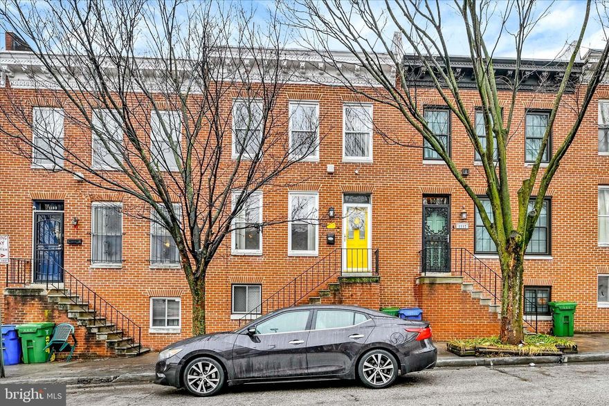 Charming brick rowhome offering 3 bedrooms, 1 full bath, and a spacious, functional layout across multiple levels. The main level features warm hardwood floors, abundant natural light, and a comfortable living area that flows into a generously sized dining space with a convenient pass-through to the kitchen—ideal for everyday living and entertaining. The kitchen provides ample cabinetry, countertop space, and direct access to the rear yard. Upstairs, three well-sized bedrooms offer flexibility for sleeping, guests, or a home office. The lower level provides additional living space perfect for a recreation room, gym, hobby area, or media space, along with a dedicated laundry area and extra storage. Outside, enjoy a fenced rear yard. Conveniently located near commuter routes, shopping, dining, and neighborhood amenities. Home is being sold-as is. Cash, conventional or private financing only.