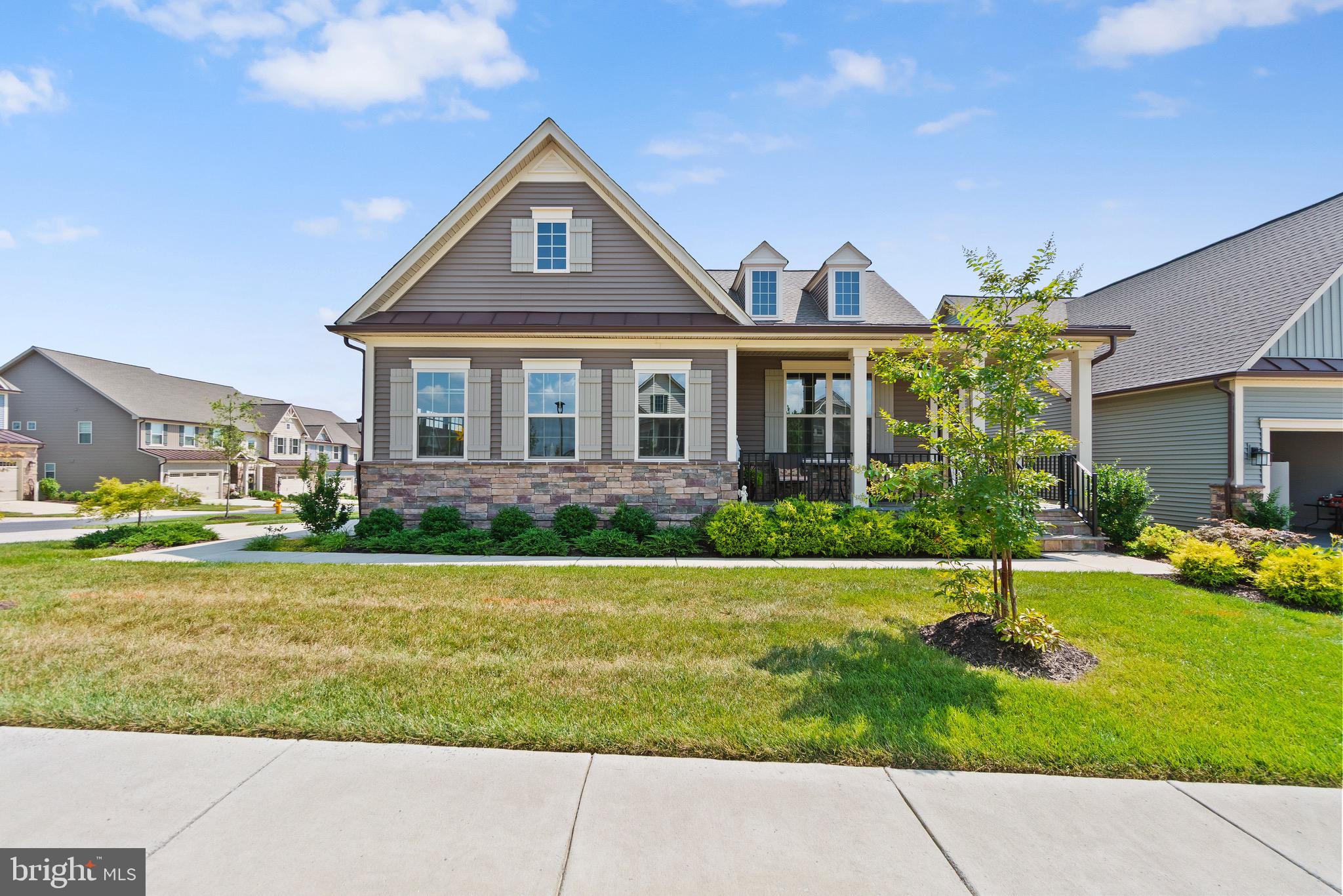 Welcome to this elegant multi-generational home, just 3 years young, nestled in the highly desirable active adult community of The Woodlands at Urbana (55+).
This vibrant neighborhood and clubhouse are filled with activities and amenities, including swimming pools, walking trails, dog parks, grandchildren playground, a state-of-the-art fitness center, golf simulator, pickleball, and bocci courts—all just minutes from major highways, shopping centers, and top-rated restaurants.
This beautiful Albright model by NV Homes offers 3 spacious bedrooms and 3 full bathrooms, with thoughtful design and luxury finishes throughout.
The main level features an open-concept layout with a modern kitchen, a large Carrera quartz island, upgraded cabinetry, and a cozy two-sided fireplace. Elegant touches such as crown molding and chair rail add charm and sophistication.
The primary suite is located on the main level, offering a large bedroom and a gorgeous primary bathroom with double sinks. This level also includes an additional bedroom and a convenient laundry room on the main floor.
The custom-finished basement is impressively spacious and perfect for entertaining, with a large recreation area, a third bedroom, a full bathroom, and a bonus room ideal as a home office, den, or guest suite. There’s even space ready to add a kitchenette, making it perfect for a mother/daughter suite or extended living space.
Enjoy the outdoors with a beautiful stone patio that connects to a double deck, featuring a screened-in porch with the double-sided fireplace—perfect for year-round enjoyment.
Located within walking distance to local eateries, this home combines luxury, comfort, and convenience in one of the most sought-after 55+ communities in the area.
The garage is finished, painted, with epoxy flooring, EV hook-up, and extra outlets for that extra refrigerator/freezer.
If you’re looking for an active adult lifestyle filled with amenities, this is the home for you.
