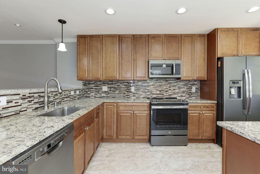 Renovated 4bed/3.5bath With New Plumbing,New Electrical Fixtures,New Fence,New Deck,New Windows,New Redesign Kitchen with Slate Appliances,42" K-Series Cabinets,Granite Counter-tops,Back-Splash&Ceramic Floor,New Bathrooms,New Hotwater Heater,New HVAC,New Flooring to include wood,ceramic and wood-like water resistance Laminate.Finished basement with Family Room,Full Bath and Bedroom(NTC).Agent Own