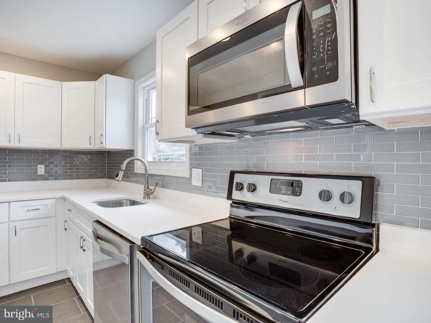 TOTALLY UPDATED!! 4 Bedrooms & 2 Full Bath House on a LARGE 1.44 Acre Lot - Minutes From Beaches, Marinas, Restaurants, Shopping & Water Park.  Just 5 Mins From Beaches, Water Parks, Restaurants, Shopping & Marinas. Commute to DC in Just 40 Mins. Main Level Offers 3 Beds, a BrandNEW Kitchen w/ Quartz Counters & Stainless Steel Appliances, New Mocha Hardwood Floors & Full Bath w/ Ceramic Tile. Lower Level w/ New Wall to Wall Neutral Gray Carpet, 1 Bedroom & Full Bath w/ Ceramic Tile. Everything is NEW - Roof, Recess Lighting, 2 Small Retaining Walls in Front and Back Yard, Modern French Drains, HVAC, Windows, Siding, Driveway, Freshly Painted & SO MUCH MORE!  Don't Miss this ONE.