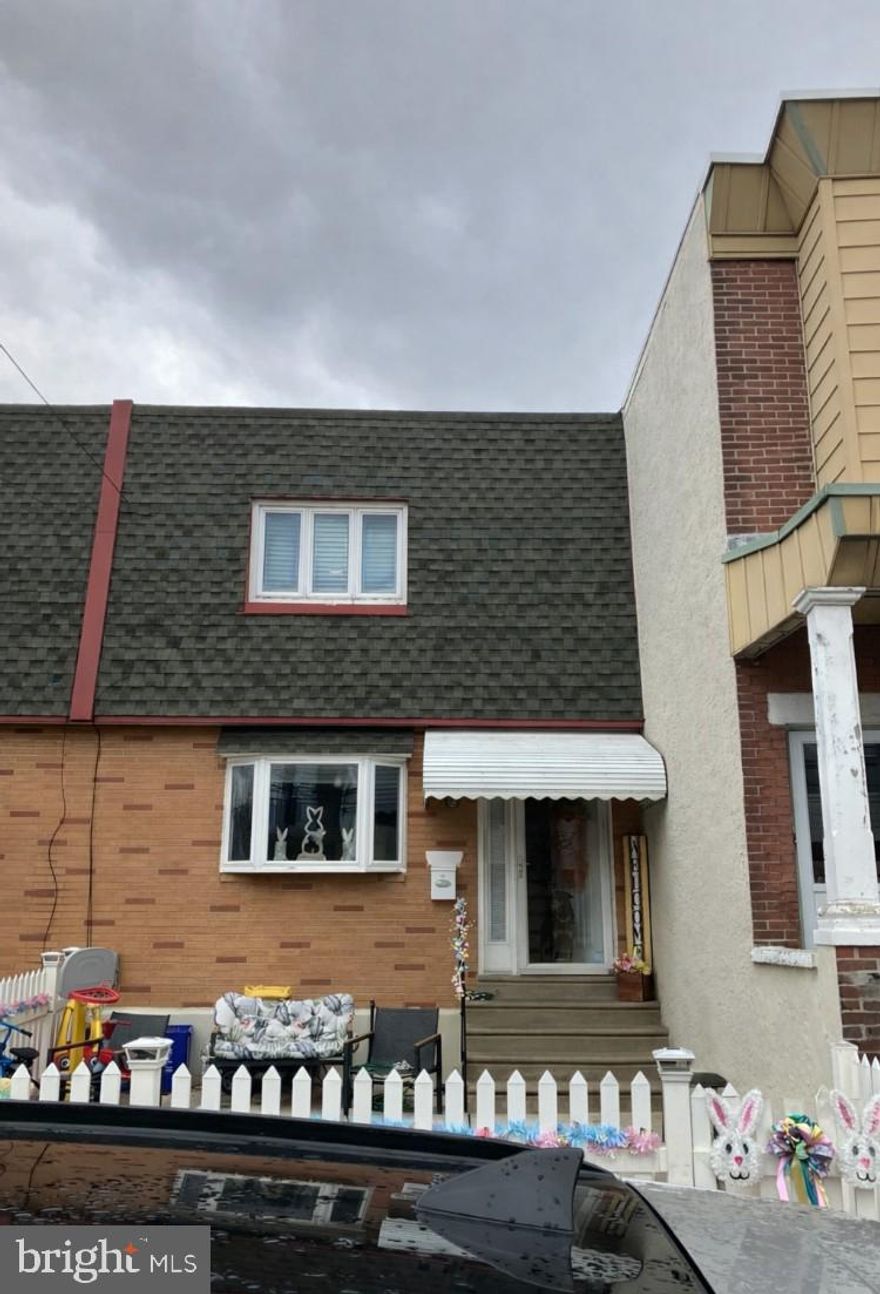 Prime Bridesburg  19137  !! With garage and 2 car driveway !!
Great interior townhome with front fenced  cement yard . 
Newer screen door with metal security door . Formal living room with front bay window with recessed lights . Newer luxury  vinyl flooring with recessed lights , ceiling fan light , crown moldings , decorative  fireplace , living room  dining room  combo . Double coat closet . Large modern eat in kitchen (2023) with stool seating area , quartz counter tops , stone accent wall , white shaker cabinets, stainless steel  appliances including refrigerator, gas range , wine fridge , deep stainless steel  sink , garbage disposal  , glass tiled backsplash, stainless  steel microwave , recessed lights . Sliders out to a modern trex composite deck , vinyl railing. , ceiling fan light , covered hard aluminum awning with grill bump out . Finished basement with ceramic tile , 2 closets , ceiling tiles , recessed  lights , new full bath with stall shower , ceramic tile floor , pocket door to laundry hall , new 100 service box and service cable . Rear exit to  garage, shed and rear 2 car driveway (3 if you put one at the end since its the end of the block )  .  Block foundation . New rear screen door . 
2nd floor  offers rear bedroom  1 with hardwood  floors , deep closet  , ceiling fan light ,middle  bedroom with celing fan light , hardwood  floors , closet . Modern hall bath with stall shower , barn style  glass shower doors  , ceramic tiled floors and walls , new vanity , sink cabinet with granite top , toilet ,and  skylight . 
Master bedroom  with hardwood floors , 2 double wall closets , accent wall , ceiling fan light .
This is your chance to own in Bridesburg with parking  !!! Come and make  this home  yours !

Professional photos coming soon !