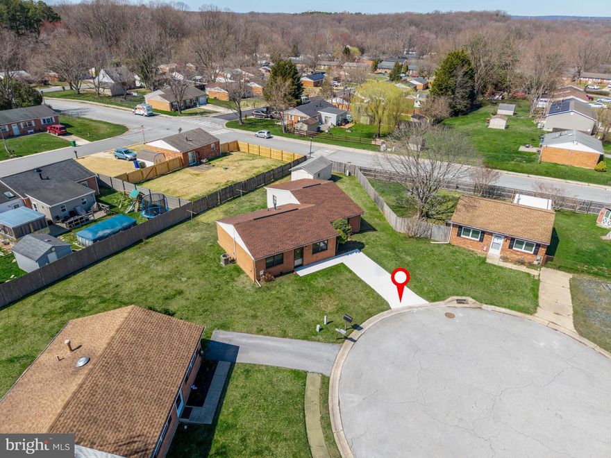 Main-floor living made simple and easy!  While most homes in the neighborhood were built with 2-3 bedrooms, 34 Archer Circle boasts a total of FOUR bedrooms and an addition featuring a large living room that could easily transform into an in-law or guest suite. Aerial photos show how large this home in comparison to the standard model offered by the builder in 1980.
Recent updates include a newly updated kitchen with brand new cabinets, range microwave, granite countertops, replacement sink, garbage disposal and fresh paint.  Also new is a thermal sliding glass door leading to a level backyard space.  
New plush carpeting exists throughout all four bedrooms and both living spaces. The full bath has been updated since original and includes grab bars in the shower tub and a new exhaust fan and vanity lights. Other extensive updates include new HVAC, hot water heater and several windows. 
Outside you'll find a freshly poured concrete driveway and front path. Hobbyists or craftsmen are sure to love the large (12x20) outdoor shed complete with electric service, lighting, shelving and a workbench! A NEW ROOF with architectural shingles rounds out this exceptional home!  Situated on one of the largest lots in the community, it's sure to sell fast!