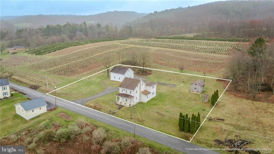 Discover the perfect blend of country charm and character in this delightful farmhouse, brimming with potential.  Built in the late 1800's this 3-bedroom, 2 full bathroom house offers a warm inviting atmosphere ready to be transformed into your dream retreat.  Main floor offers large eat in kitchen with porcelain farmhouse sink, plenty of cabinet and countertop space.  Spacious open concept dining and living rooms with original wooden details, built ins and chunky wooden pillars.  Full bathroom with walk in shower and main floor laundry room are a bonus.  2nd floor provides 3 nice sized bedrooms, 2nd full bathroom in addition to a full sized walk up attic offering much potential for more finished living space or an abundance of storage.  Outdoors are spectacular with your covered front porch and panoramic views of the beautiful Mahoning Valley.  Oversized 3 car detached garage with 2nd floor, workspace and plenty of storage room.  Large utility shed for gardening, mower storage and even more workspace!  This home is ideal for those seeking a serene lifestyle with plenty of space to stretch out and enjoy the outdoors, while remaining close to major travel routes!  Call today for your private showing and make this your dreamhouse!  PUBLIC OPEN HOUSE SUNDAY APRIL 13TH 1-3 PM.