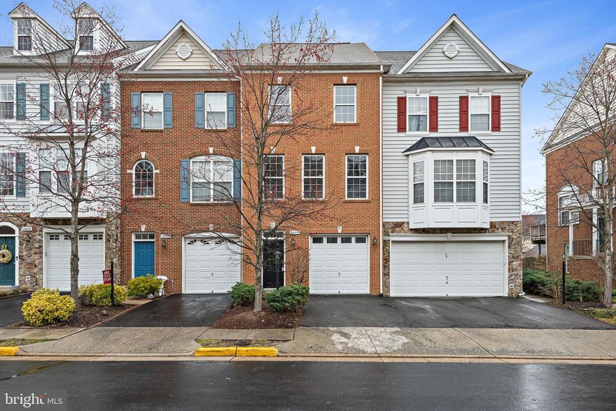 Bright and airy 3 level townhome with 3 bedrooms, 3 full and 1 half baths located in the heart of Brambleton.  Freshly painted throughout, and new carpet on all three levels along with gleaming refurnished hardwood floors in the eat-in kitchen.  Owners suite with walk-in closet and large bath. Upper level laundry.  Entry level rec room with gas fireplace and full bath leads to private backyard that opens to a more expansive common area backing to single family homes.  One car garage.   A short stroll to the Town Center with Harris Teeter grocery, fast casual and fine dining restaurants, coffee, movies and local boutiques, the Brambleton library, fitness, and all your daily needs.  Take advantage of local parks and outdoor pools, as well as walking trails through the whole community.  Hard to beat this desirable location and offering in sought after Brambleton. Call today for your private showing.