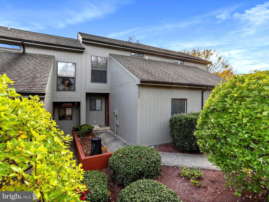 Easy Living with Lakeside Views!
Enjoy full-time or vacation living in this charming three-level townhome on Fishhook Lane, nestled along the peaceful shoreline of Sylvan Lake in The Woods. Part of the Fishhook Lane Cluster Association, this home offers low-maintenance ease with some exterior building and lawn care included—ideal for those seeking comfort without the upkeep.
The main level opens with a versatile den or guest bedroom and a full bath, perfect for accommodating visitors or creating a dedicated office. The open-concept kitchen, dining, and living areas feature a seamless layout, with sliding glass doors in the living room that lead to a private balcony overlooking the lake. A fixed window wall frames the view, while a remote-controlled retractable awning with wind monitor adds all-weather comfort outdoors.
Upstairs, the primary suite features a unique layout with a partial wall overlook to the living area below, allowing natural light to flow throughout. The en-suite bath includes a soaking tub for added relaxation.
The walk-out lower level offers two spacious rooms that can serve as additional sleeping quarters, a family room, hobby space, or home office. Sliding glass doors provide access to a second balcony and deck, offering direct access to the lakeside path—perfect for morning coffee or unwinding at dusk.
Additional features include wiring for a Level 2 electric vehicle charger (charging cables do not convey) and a transferable Class A membership to The Woods Club, granting access to amenities including golf, indoor and outdoor pools, tennis, fitness center, and more.
This townhome offers a flexible layout, serene natural surroundings, and the convenience of year-round resort living.  Some furniture will convey.