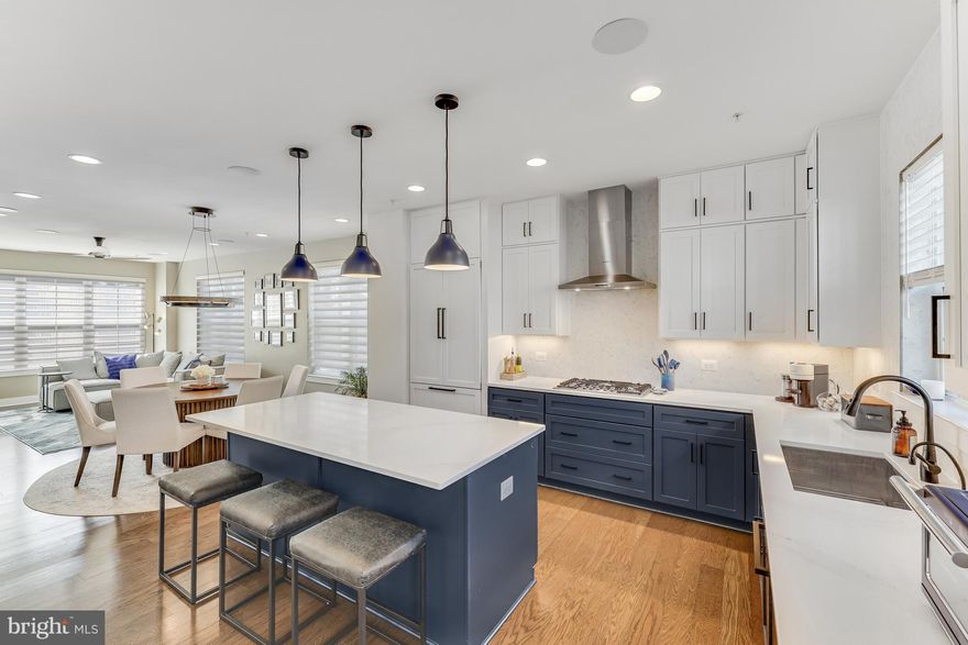 Elevator to all 4 levels in this spacious  End Unit Baker Model at the EYA Reston Station Development!    Offering 3 bedrooms and 3 full baths and 2 half baths, 2 car garage and an abundance of upgrades from the original model.  An open floor plan makes this the perfect space for entertaining and everyday living. Luxurious upgrades throughout  including  the deluxe kitchen package which boasts Bosch appliances, Silestone quartz counters and stacked shaker cabinets to the ceiling  to name a few. The primary bedroom provides 2 walk in closets and a lovely bathroom with radiant floor heating.  Entertain alfresco from your roof top deck with gas fireplace.   Conveniently located, the Wiehle-Reston East Silver Line Metro, W & OD trail  and desirable retail and restaurants are just around the corner.  Welcome Home!