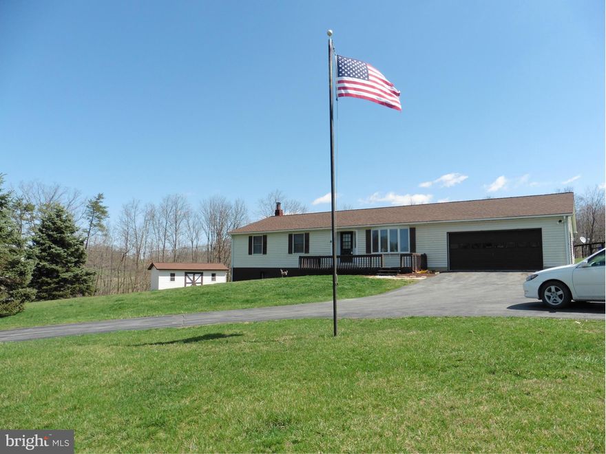 REDUCED $5K! Simple country living! Only 20 minutes to the stores and restaurants of WInchester City/Medical Center with gorgeous, mountain views year round. Live large with fenced paddocks, woods and a pond on 20 acres. Great one level living with recreation and storage in large basement, over sized garage, new carpeting, tile floors, and new roof. Seller will consider all offers. HOME WARRANTY!