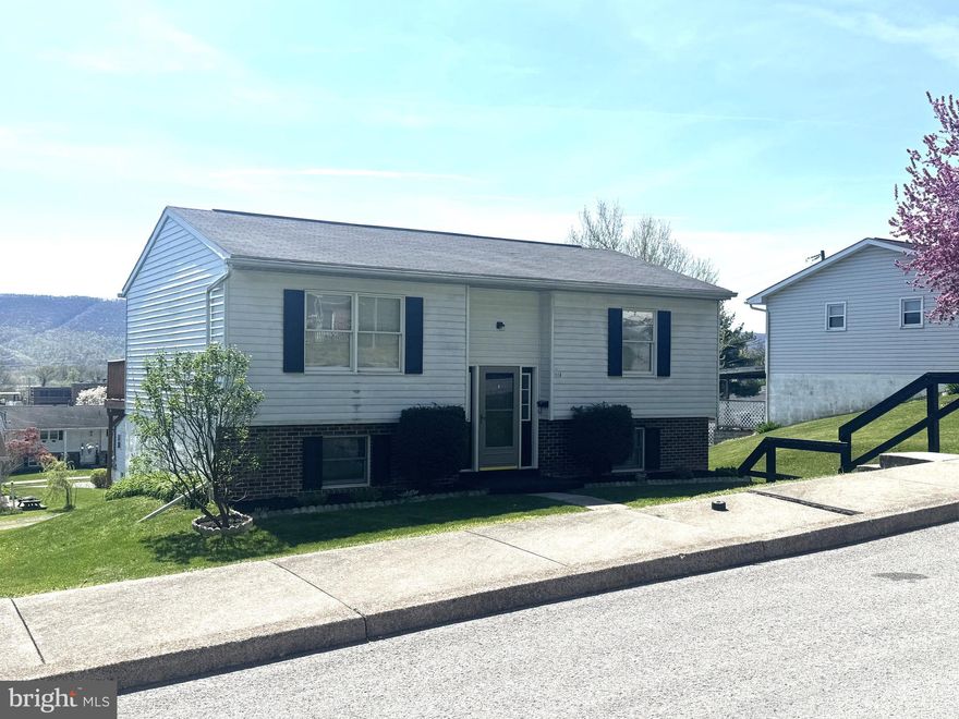 Move in ready home in Lewistown PA. This Bi-level home has been updated nicely to include a brand new kitchen with new refrigerator & dishwasher, also included is the range. Fresh new carpet & flooring along with fresh paint throughout. The home features 2 bedrooms and 1 full bathroom on the main level. The lower level has a finished rec room and laundry area. There could easily be a 3rd bedroom added.  The integral garage enters the basement along with a separate man door to the back yard. The home has a large rear deck that has amazing views, a rear driveway for nice off street parking.