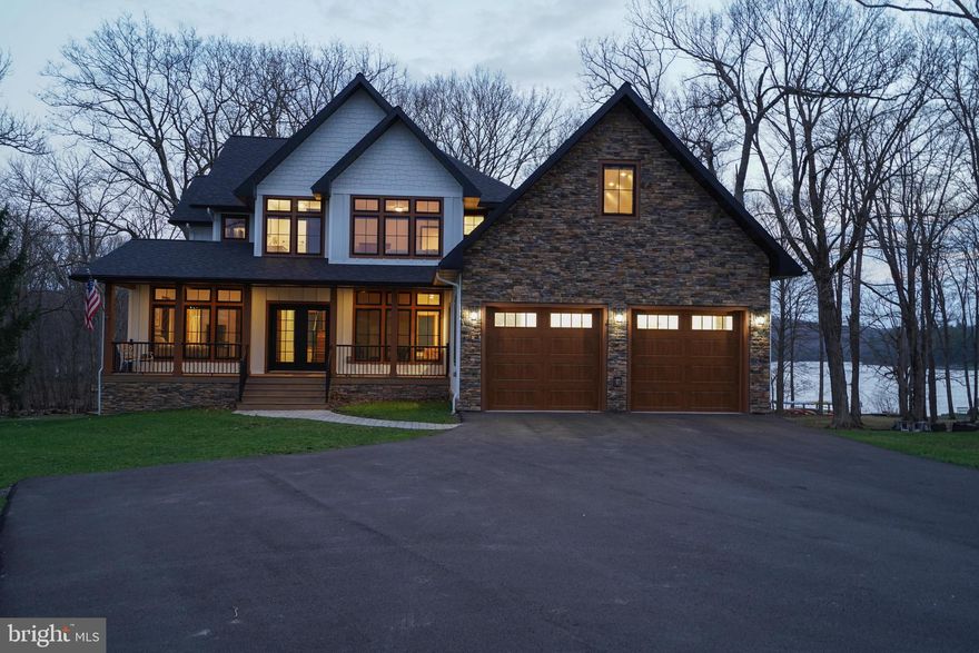 Luxury meets lakefront! 294 Stilwater Drive brings lakefront living to its finest. Located in the Stilwater community, this property offers lake access with a single dock slip at the community dock, just a short distance in front of the home. Offering 7 bedrooms, 6 full and 2 half bathrooms spread over 5800+ square feet of finished living space, this home was built to entertain guests, host your favorite events or enjoy the serenity of the lake glistening from the porch.  Recently built in 2025 with rental capabilities in mind, this home has all of the necessary short term rental fire suppression and alarm systems to be rented as a 7 bedroom home, something you do not see often. Additionally, the single dock slip for this home is located directly in front of the home with only 3 slips at this dock, giving a more private feel at the lakefront. Sold mostly furnished, this creates a nearly turn-key opportunity for investors, second homeowners and primary residents alike.  If you are truly looking for one of Deep Creek Lake's finest lakefront homes, you have found it at 294 Stilwater Drive!